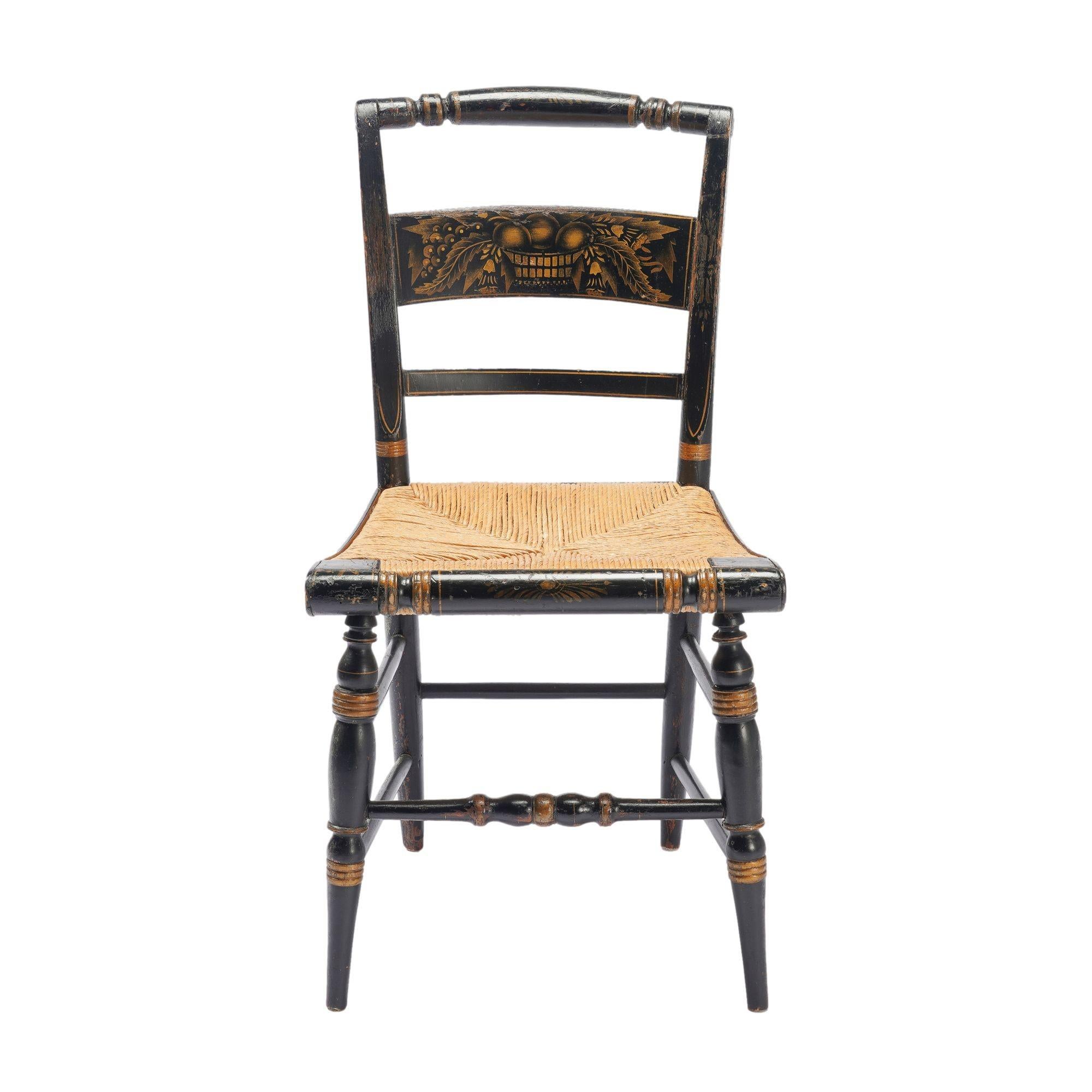 Set of 4 classic Hitchcock style side chairs of painted and stencil decorated mixed woods, fitted with handwoven rush seats. The turned and bowed crest rails are morticed to the turned and splayed upper leg posts. Beneath the crest rail is a stencil
