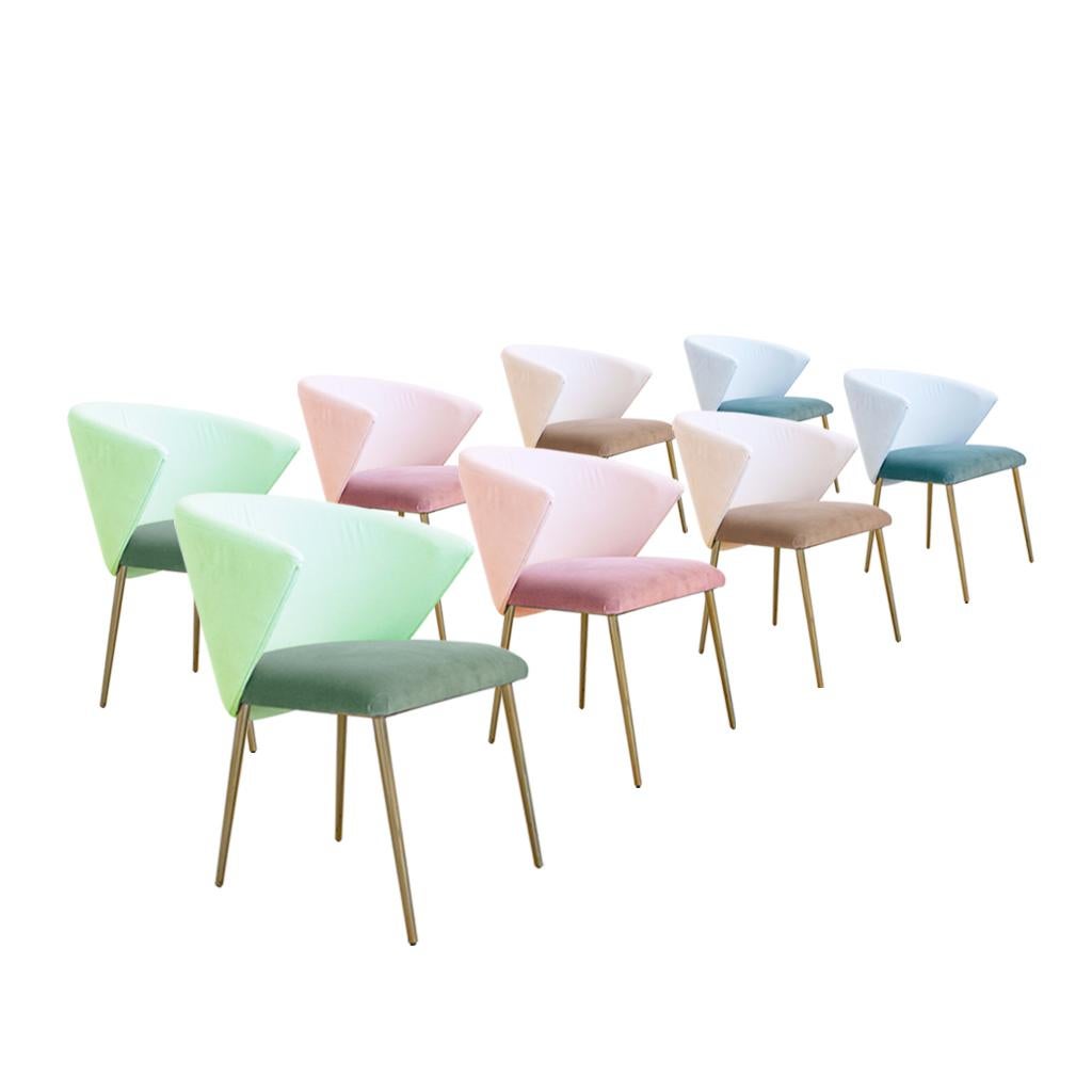 Set of four contemporary modern dining chairs made of solid wood structure and four brass legs. Upholstered in plain cotton velvet in different colour shades. Italian manufacture.