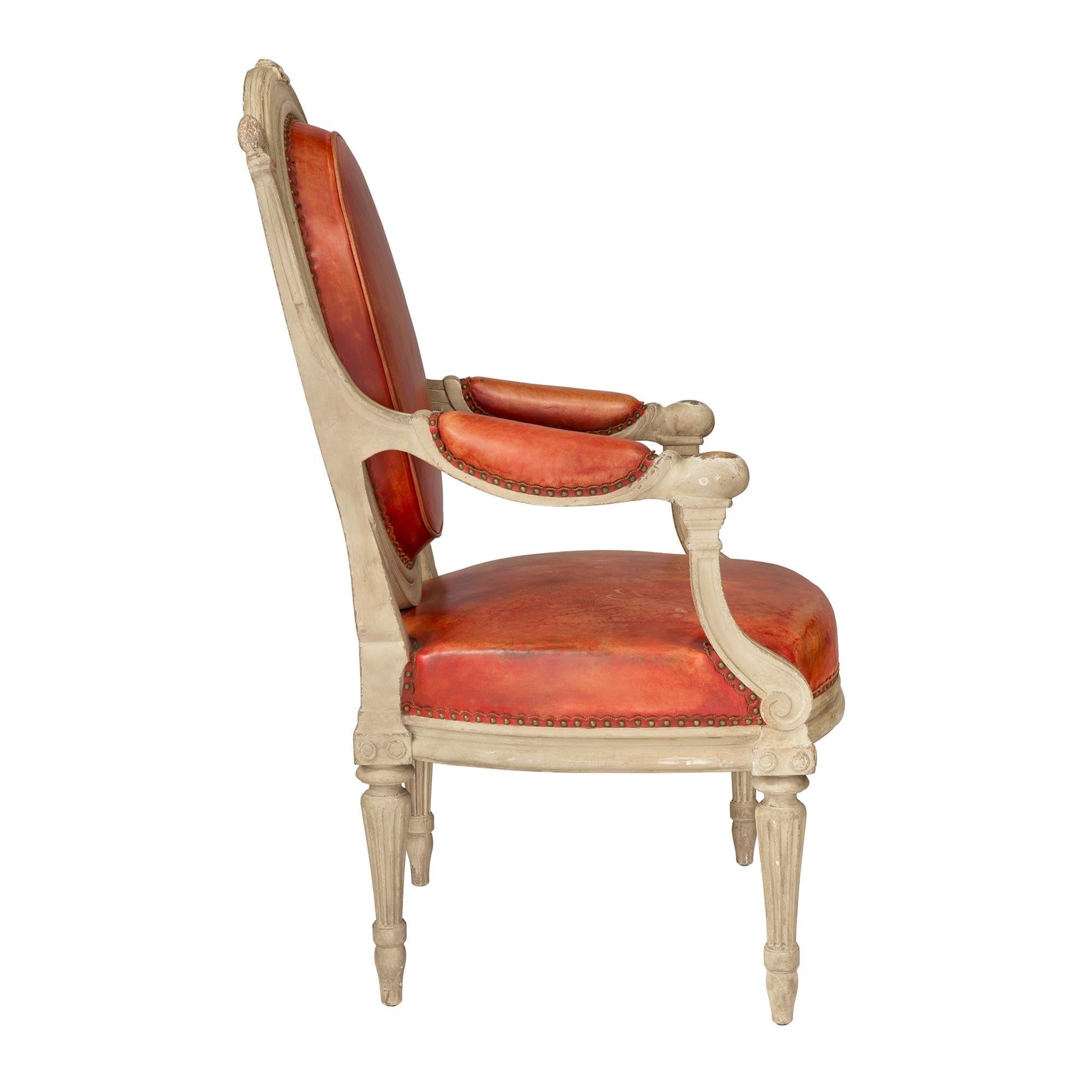 Patinated Set of Four Continental 19th Century Louis XVI Style Armchairs For Sale