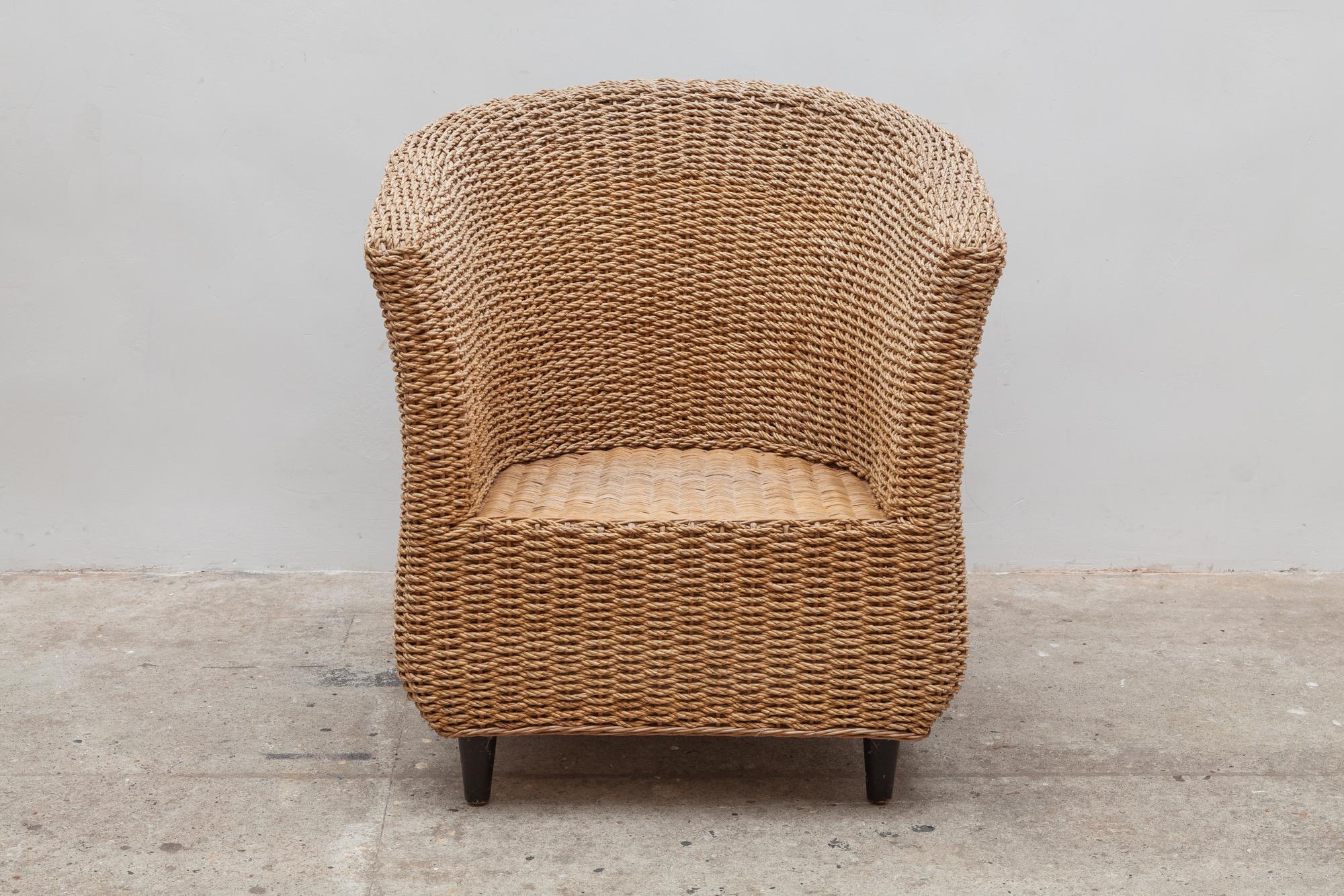 Vintage woven cord bucket chairs. U-shaped design with wooden legs. Dimensions 75 W x 78 H x 75 D cm. Perfect for the home or covered outdoor patio.