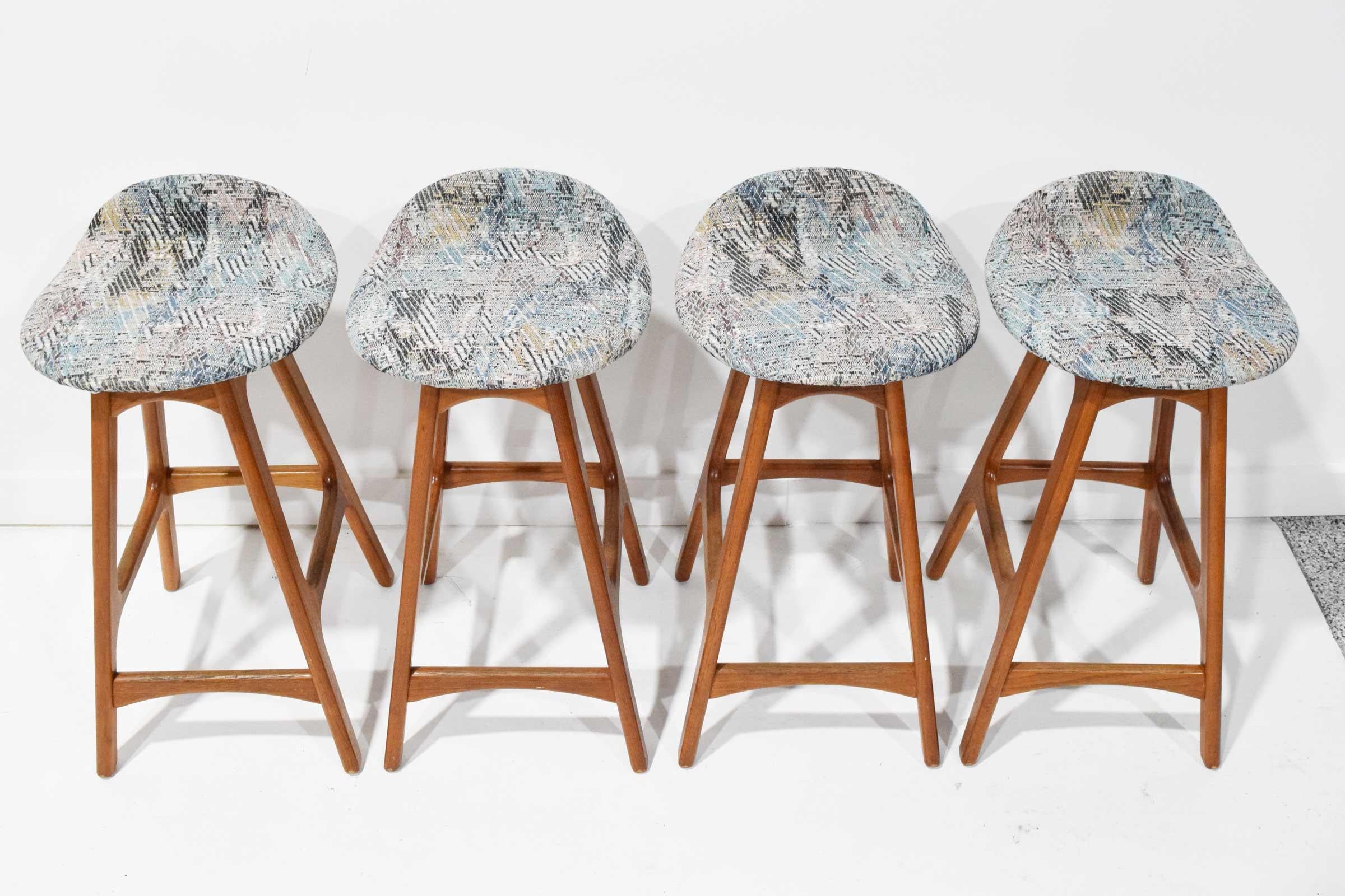 Sculpted stools teak wood, seats upholstered in woven fabric that was covered by vinyl for decades. Model OD 61. Designed by Erik Buch in the 1960s for by O.D. Møbler in Denmark.

    

You will see these stools featured in the Mad Men movie set