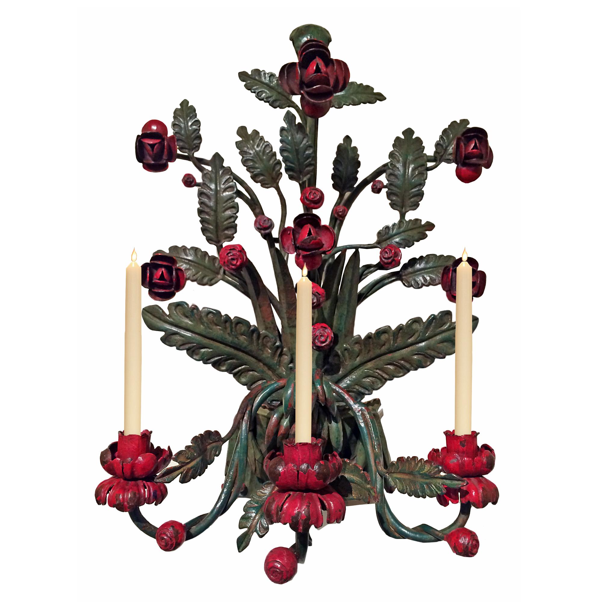 A very attractive set of four Country Italian 19th century patinated wrought iron sconces. The Mediterranean style hand painted wrought iron sconces, each with three fanciful 'S' scrolled detachable arms are garnished with decorative vibrantly