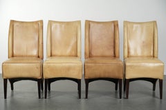 Set of four cowhide dining chairs with a comfortable seat and high back