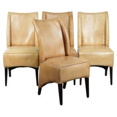 Set of four cowhide dining chairs with a comfortable seat and high back