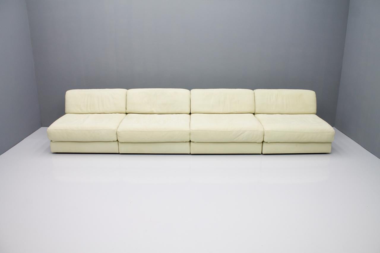 Four modular sofa elements in soft and rare cream colored leather by De Sede, Switzerland.
Very high quality workmanship with fantastic very soft aniline leather. The elements can be connected to each other or placed freely.

Signed with De Sede