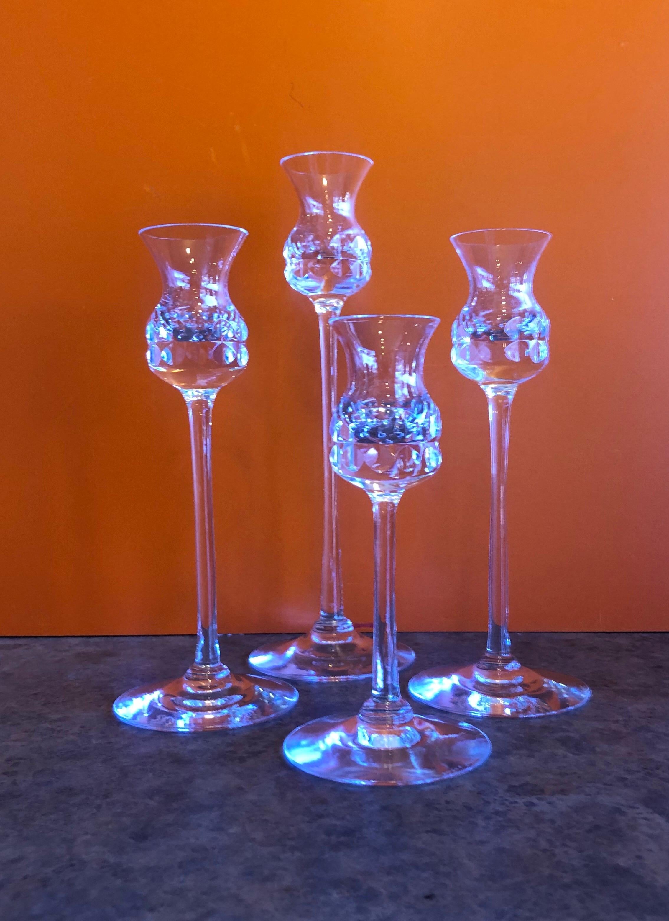 Gorgeous set of four crystal candlesticks by Goran Warff for Kosta Boda, circa 1970s. The candlesticks are 11