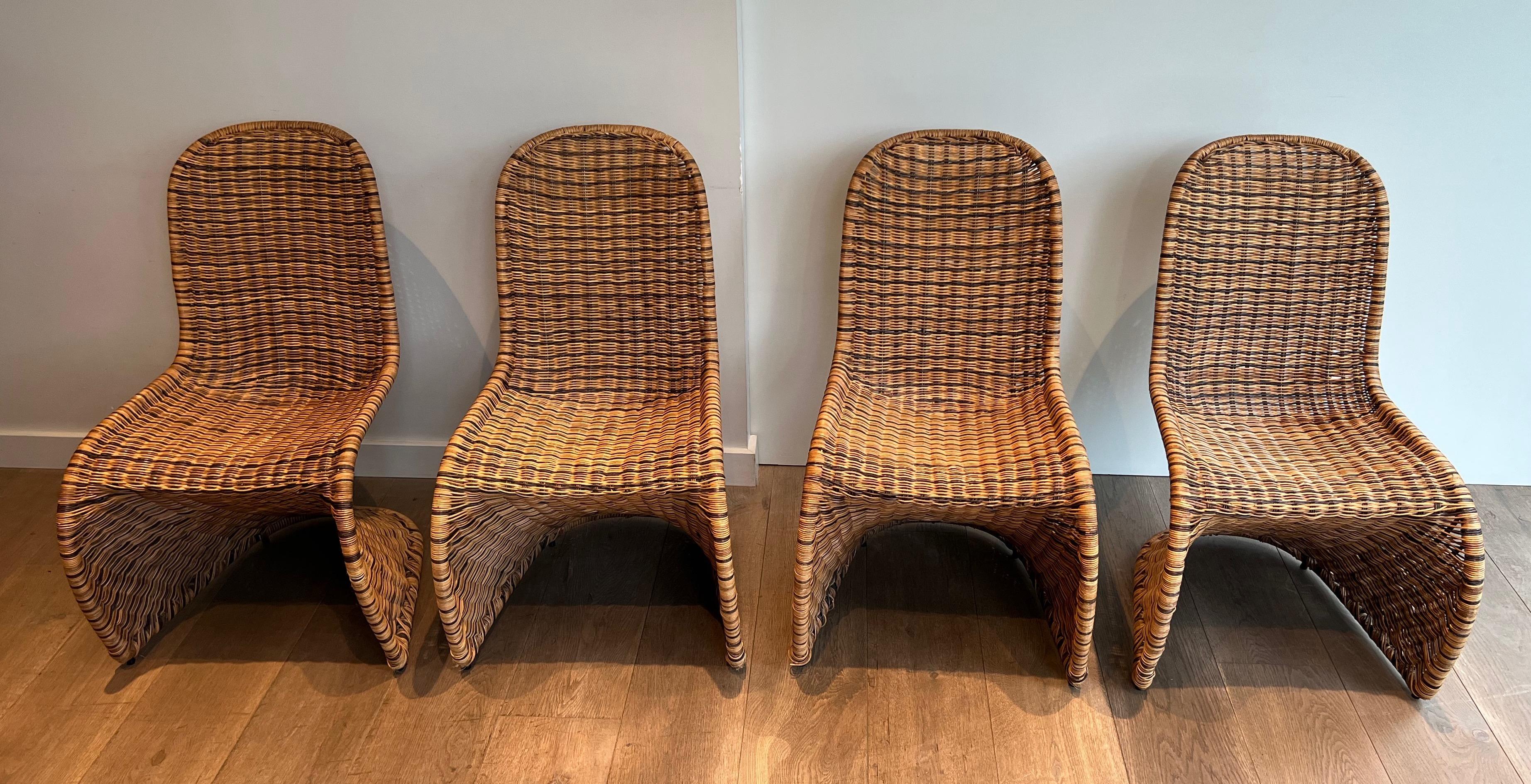 This very nice and design curved chairs are made of rattan chairs. This is a French work. Circa 1970