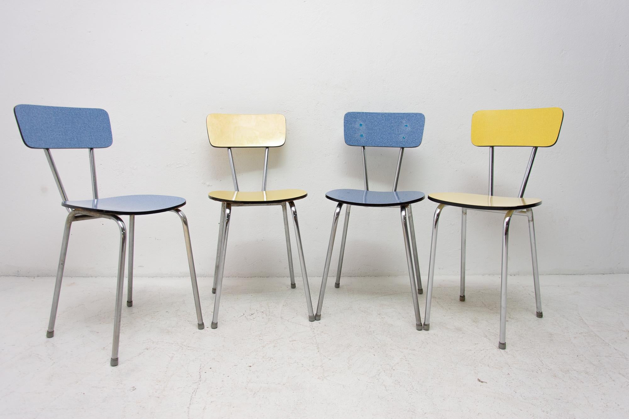Set of four midcentury color Formica cafe or dining chairs with chrome legs. Made in the 1960s. In very good vintage condition. Price is for the set of four.
