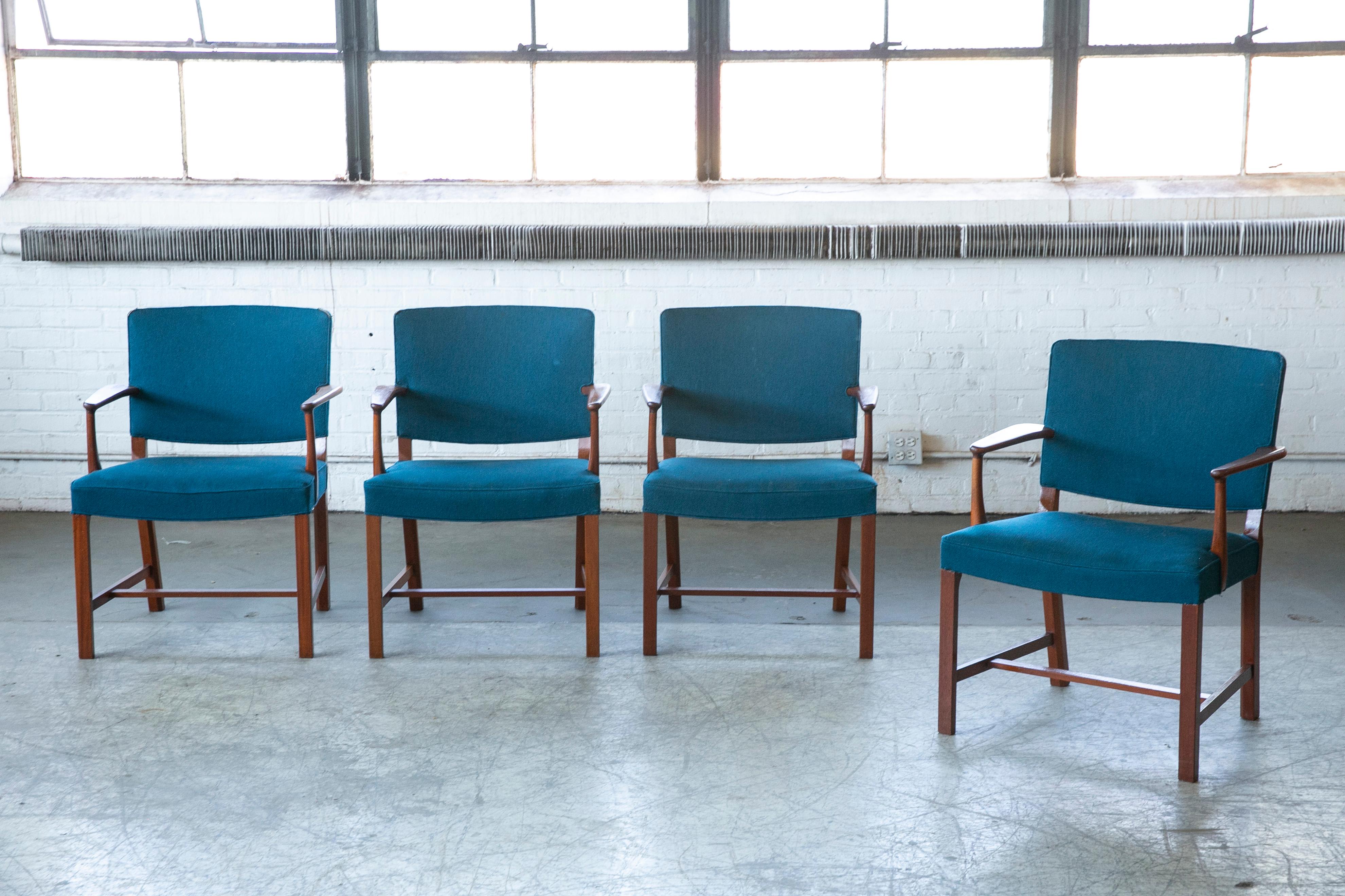 Classic elegant Danish armchairs from the 1940s by Furniture Maker, Erik Bjørn Olsen and produced by his own firm. The chairs were originally delivered to the Danish High Court, Eastern District in Bernstorffs Palæ in Copenhagen. Mr. Olsen was a
