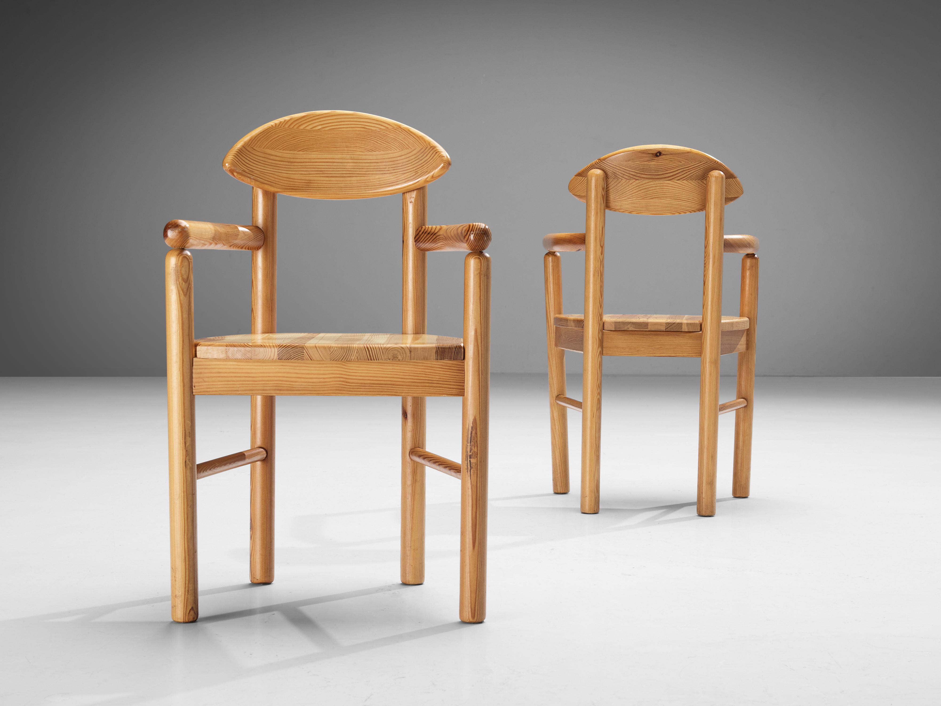 Armchairs or dining chairs, pine, Denmark 1970s. 

Beautiful, organic and natural set of four dining chairs in solid pine. A simplistic design with a round seating and attention for the natural expression and grain of the wood. These armchairs