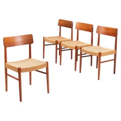 Juego de cuatro sillas de comedor danesas de teca y cordón de papel. Dinamarca, 1960