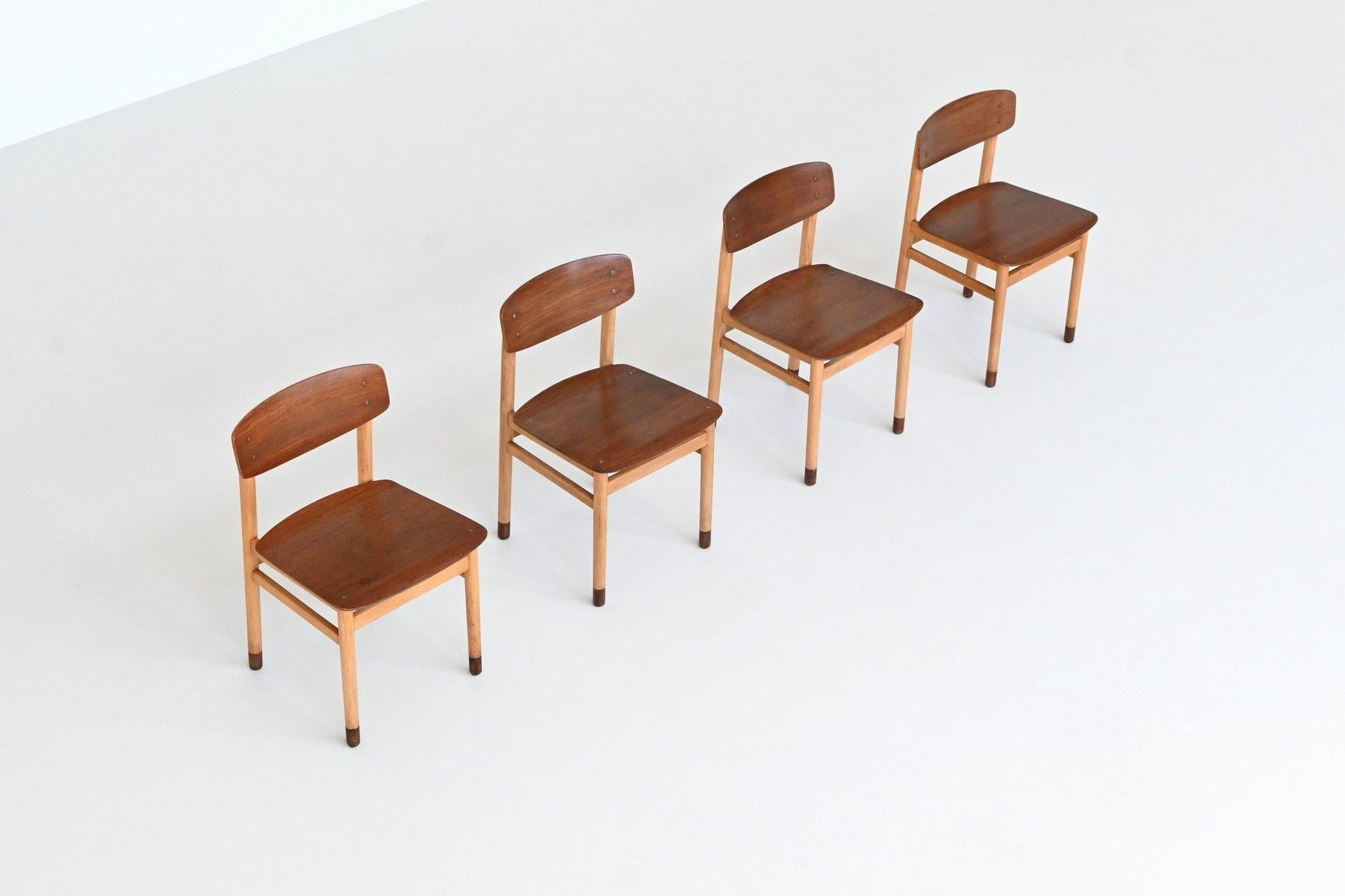 Beautifully shaped and finely balanced, this set of four dining chairs was crafted by Kvetny & Sønners Stolefabrik in Denmark circa 1960. With their elegant proportions and subtle detailing, these chairs are a textbook example of Danish mid-century