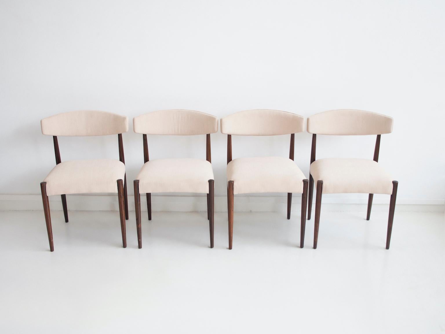 Four chairs made of kingwood from circa 1960. Later upholstery in white fabric. Manufactured in Denmark.