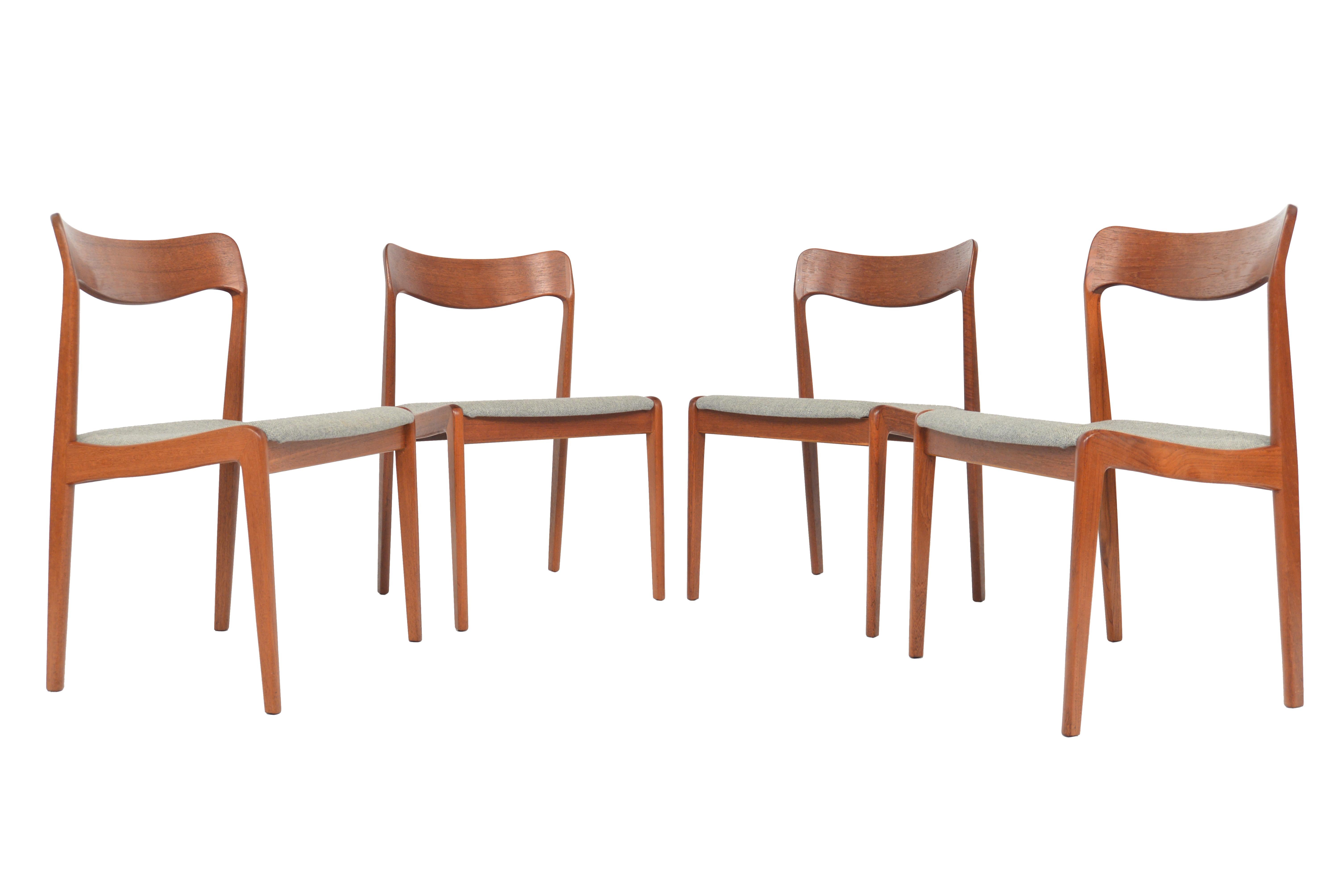 This set of four Danish modern dining chairs offer beautifully sculpted teak frames and nested seat bottoms. Seat bottoms are covered in grey Hallingdal wool. In excellent original condition.

   