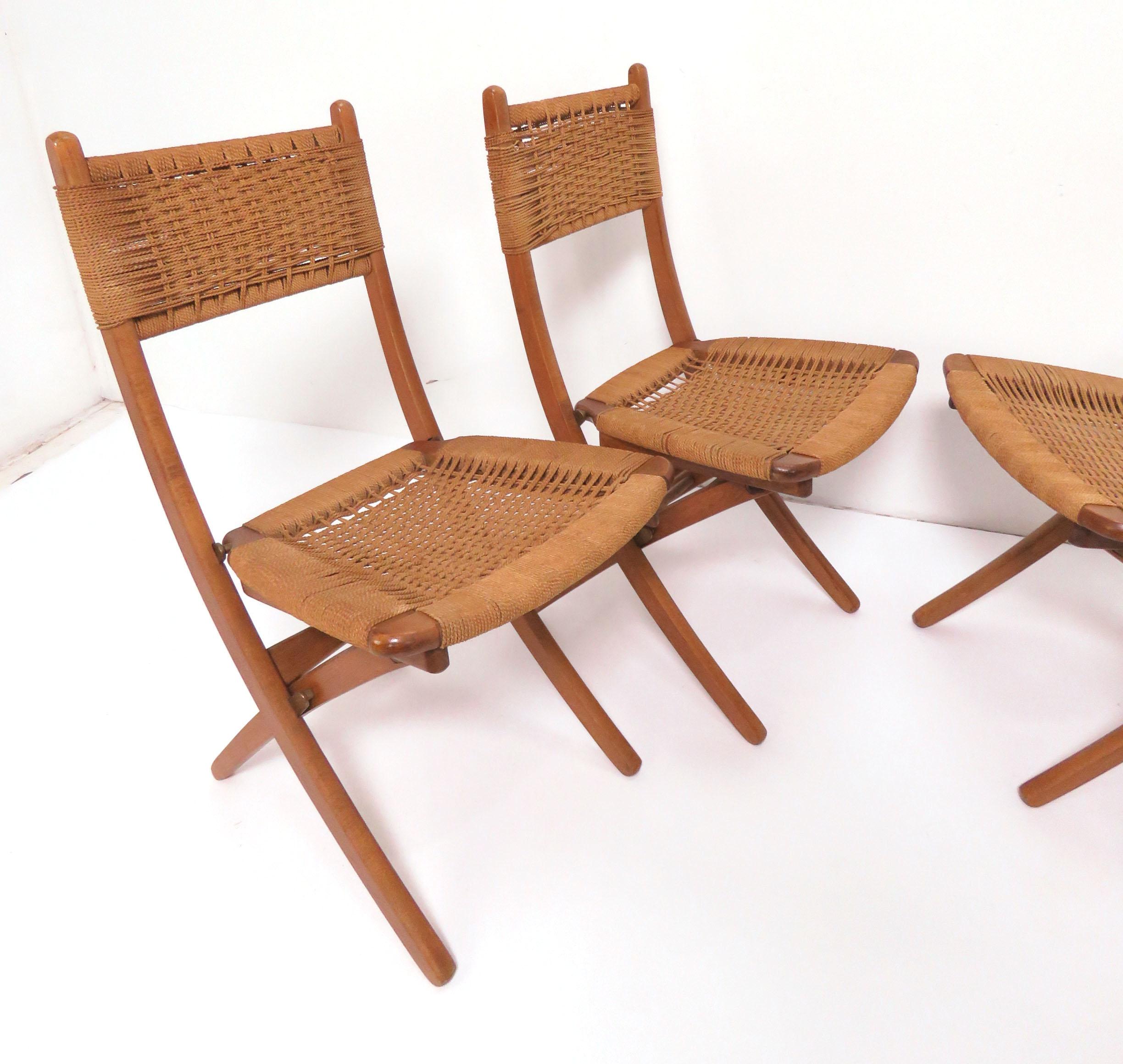 Set of four folding chairs with rope seats and backs, made in the Danish modern style in Yugoslavia, circa 1960s.