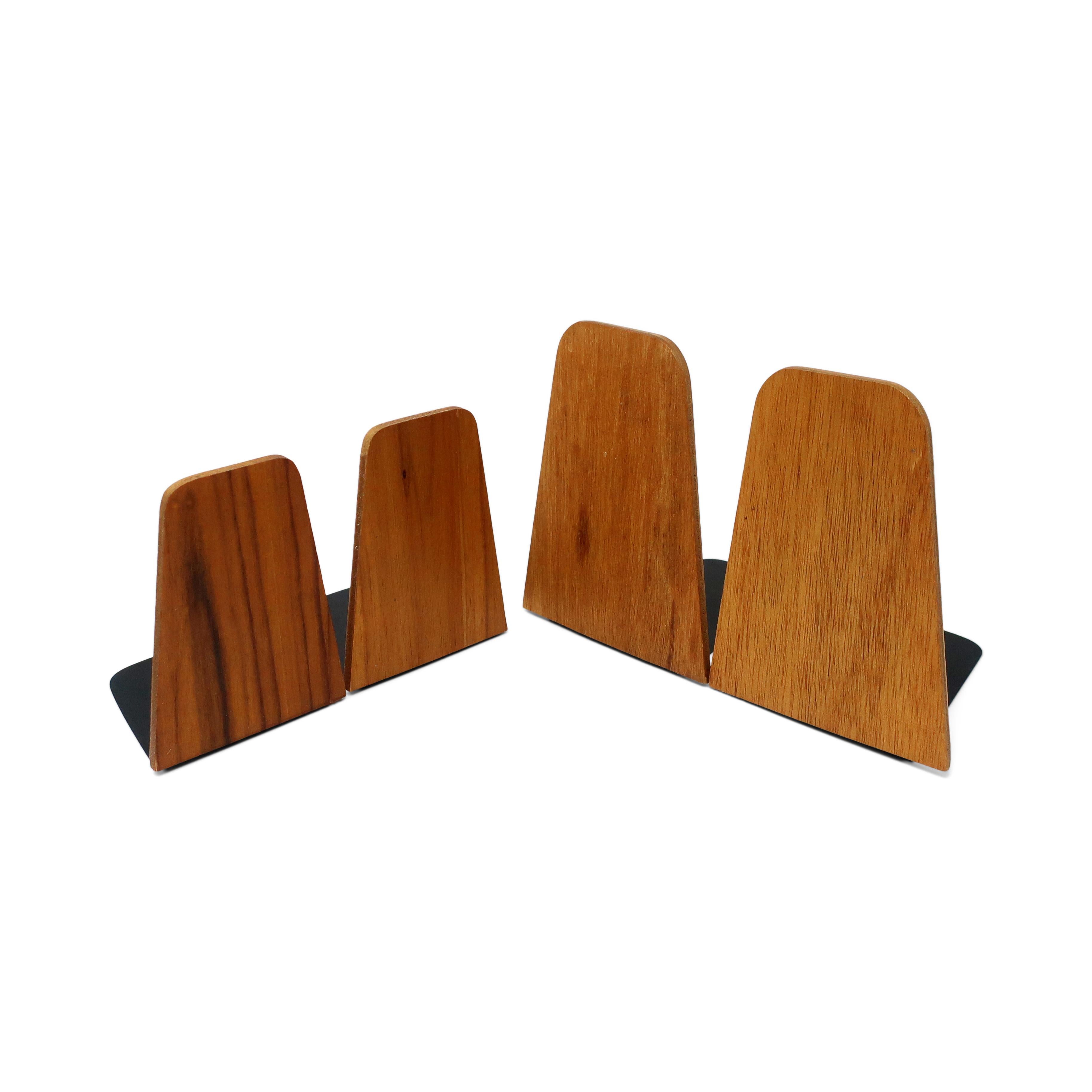 Two pairs of functional and simple teak bookends exemplifying the best of mid-century and Danish modern design. Extremely lightweight but able to hold lots of book due to their design, which is attributed to Kai Kristiansen for Fornem Møbelkunst.