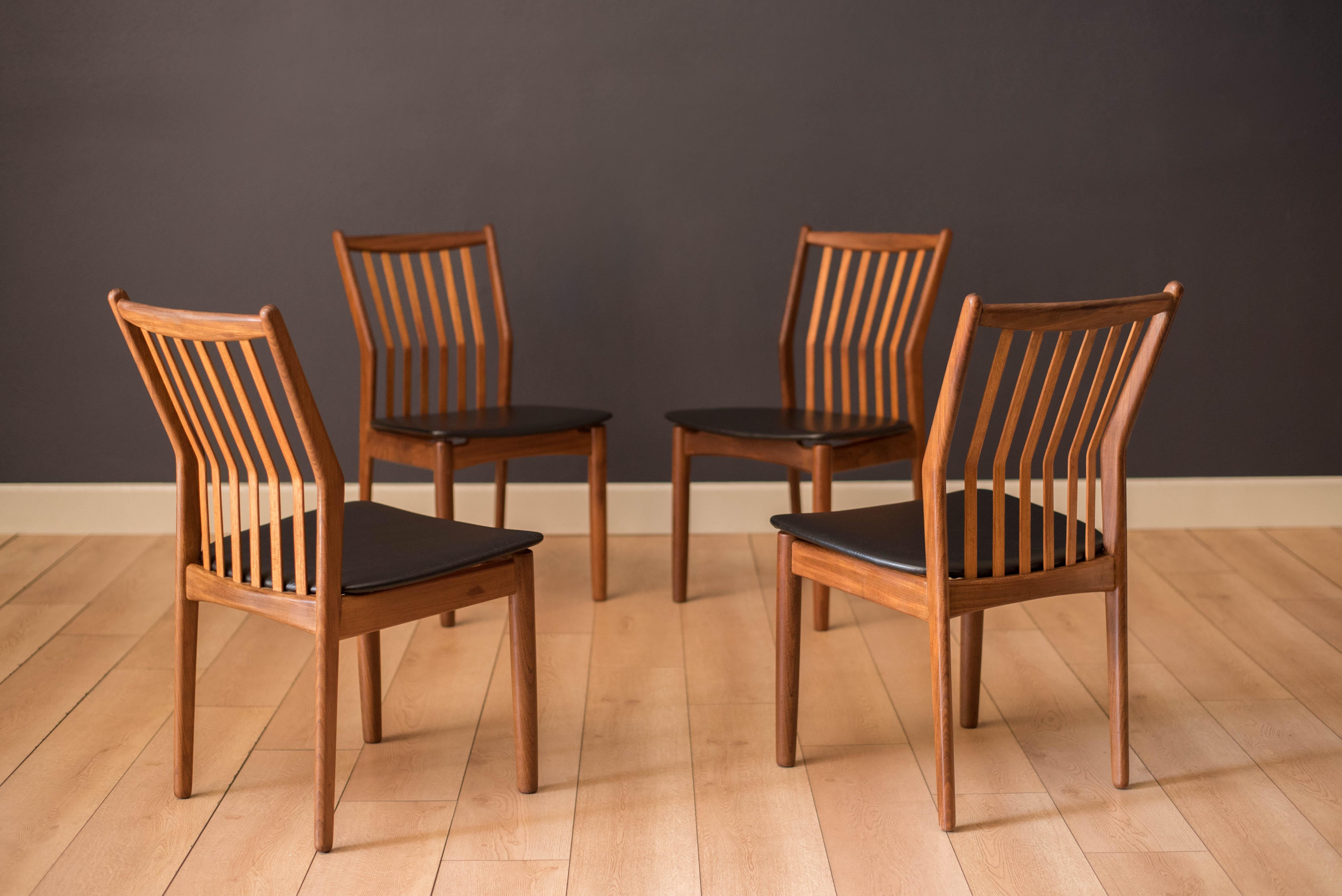 Mid-Century Modern set of four dining chairs in teak and afromasia by Svend Madsen for Moreddi, Denmark circa 1960's. Features a supporting curved backrest and a wide frame seat unusual for Danish design. Retains the original black leatherette