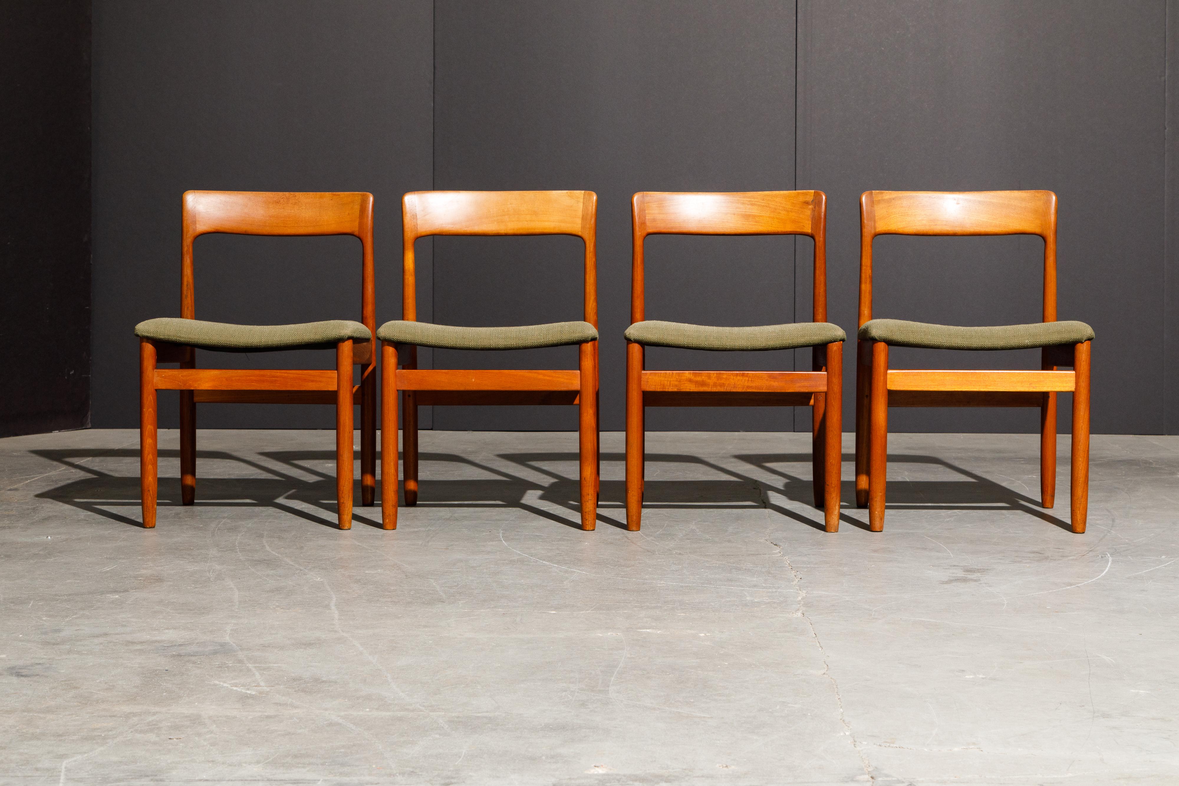 A set of four (4) classic Danish Modern teak side chairs in the style of Niels O. Møller for J.L. Møllers Møbelfabrik. The teak frames with curved seat backs are elegant and sophisticated, original fabric upholstered seats are ready for reupholstery