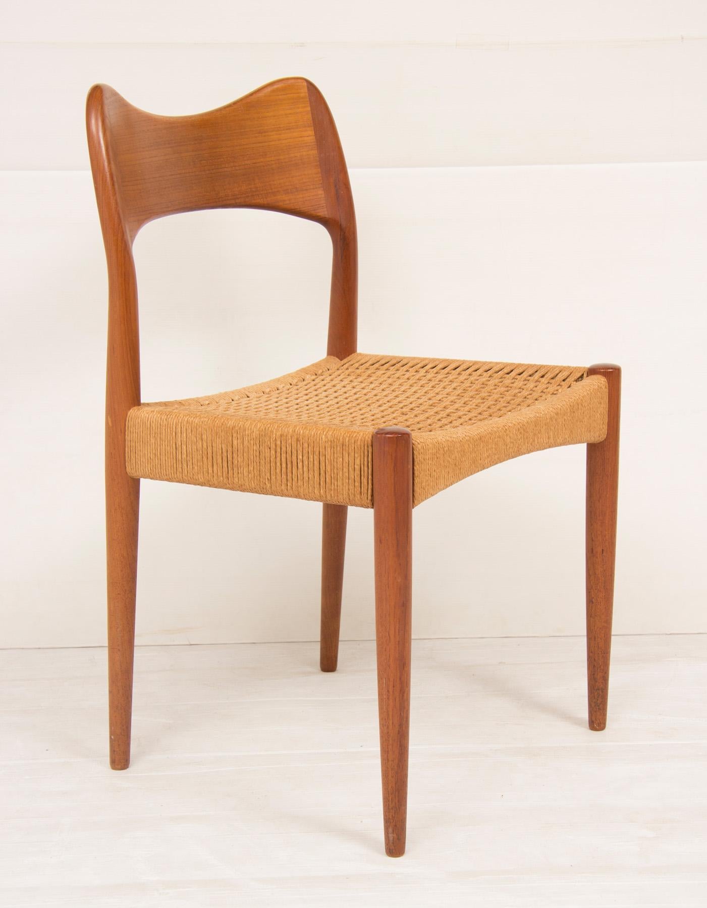Set of four Arne Hovmand Olsen chairs for Mogens Kold. Teak frames with original paperboard seats.