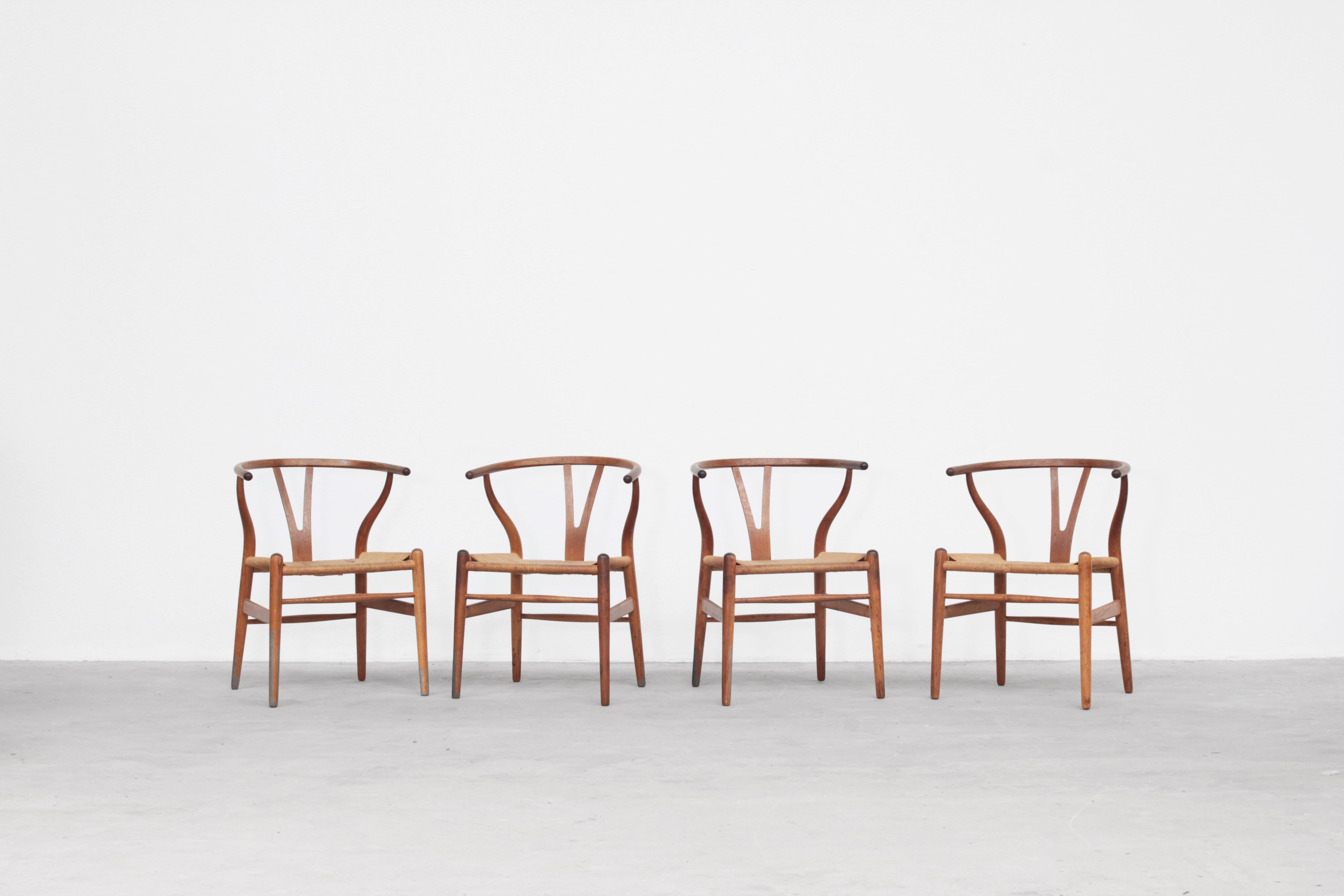 A set of four beautiful and original wishbone chairs designed by Hans J. Wegner and produced by Carl Hansen in the 1960s in Denmark. All chairs are made out of oak and in original condition with signs of usage.

We have six more of this model in