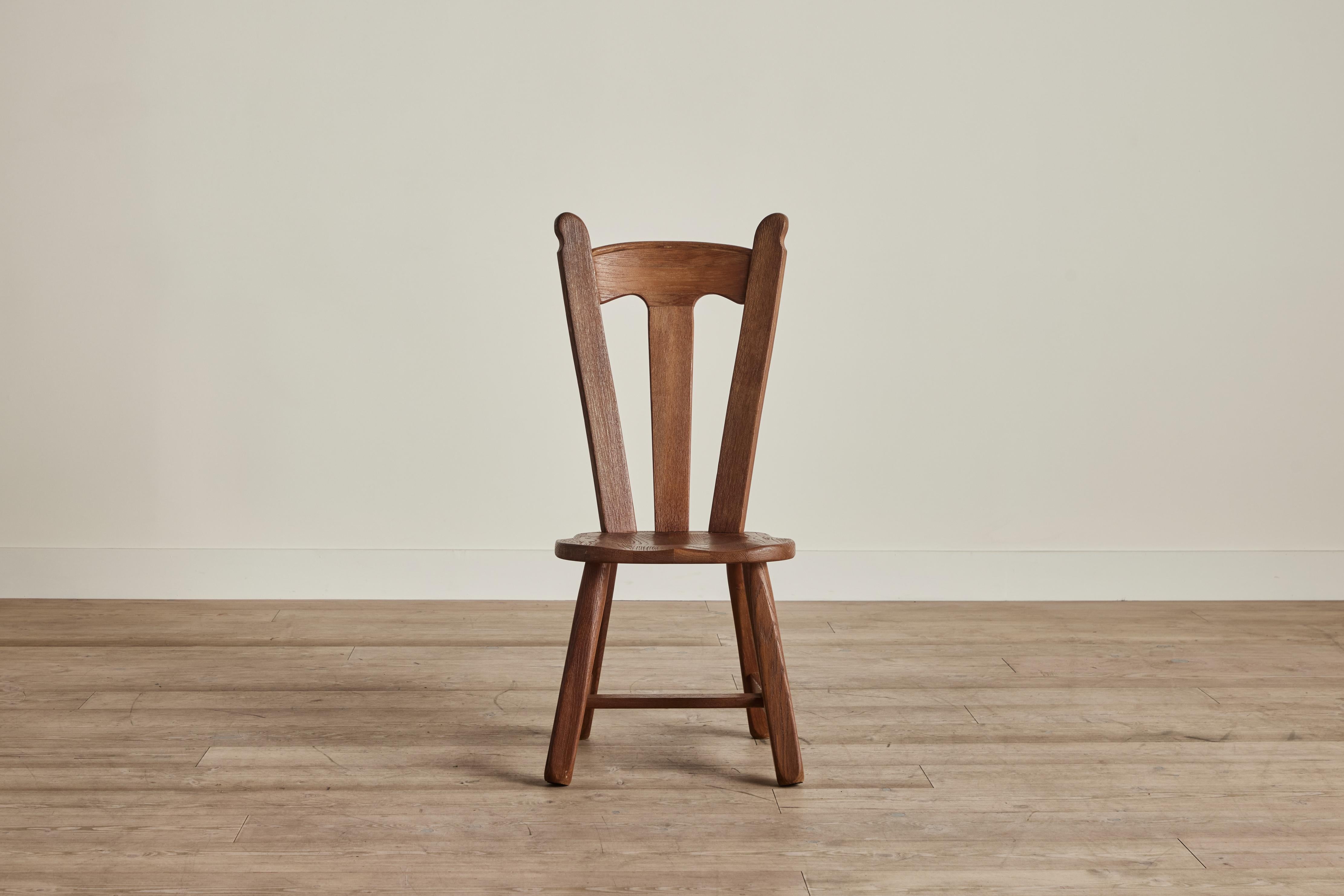 Set of four Brutalist dining chairs attributed to Belgium furniture maker Kunstmeubelen De Puydt circa 1960. Some visible wear on wood and finish that is consistent with age and use. 