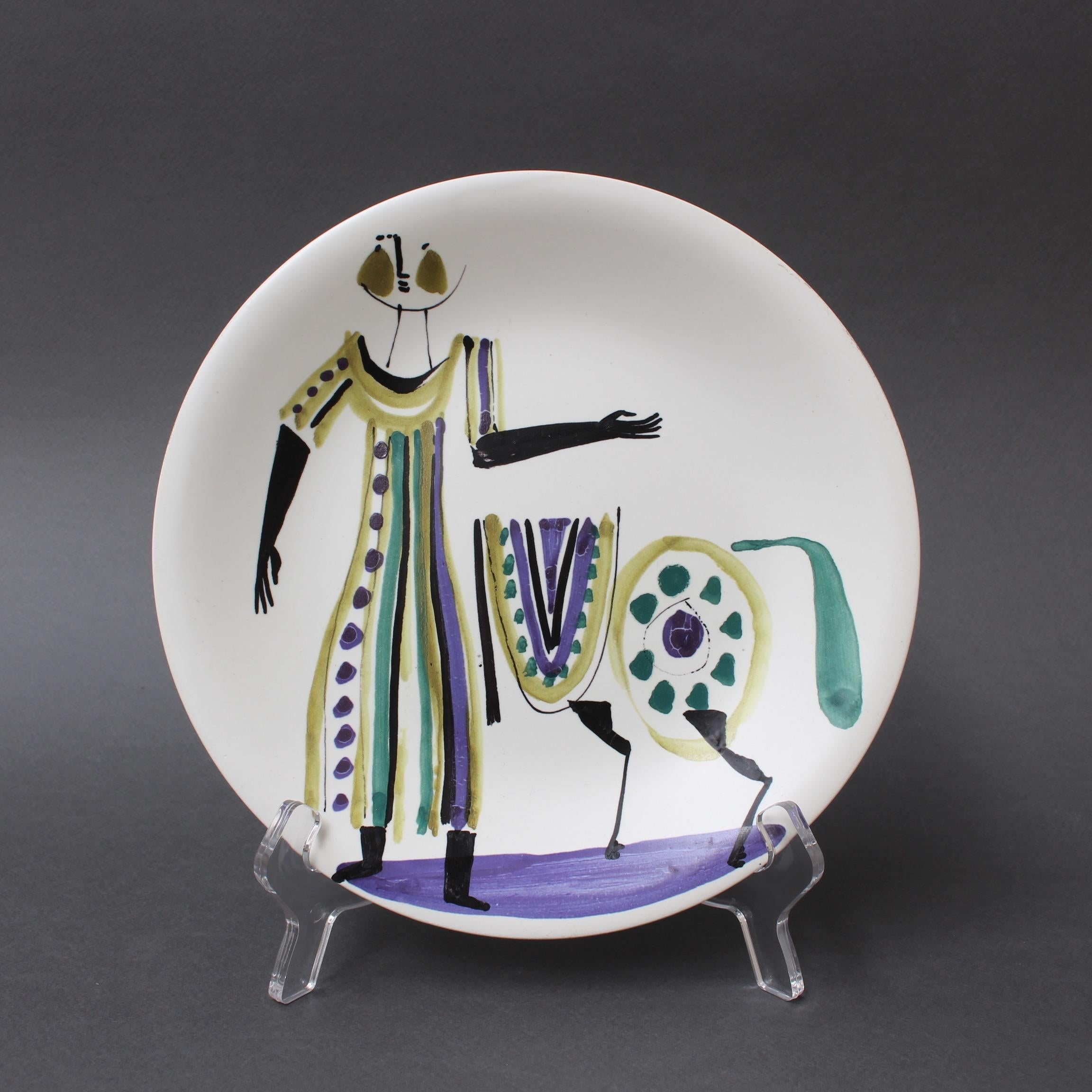 Set of four decorative plates by Roger Capron (circa 1950s). Acquired from a family of Capron collectors who have held them for over 60 years, these plates with stylised characters are in excellent vintage condition with only very minor blemishing