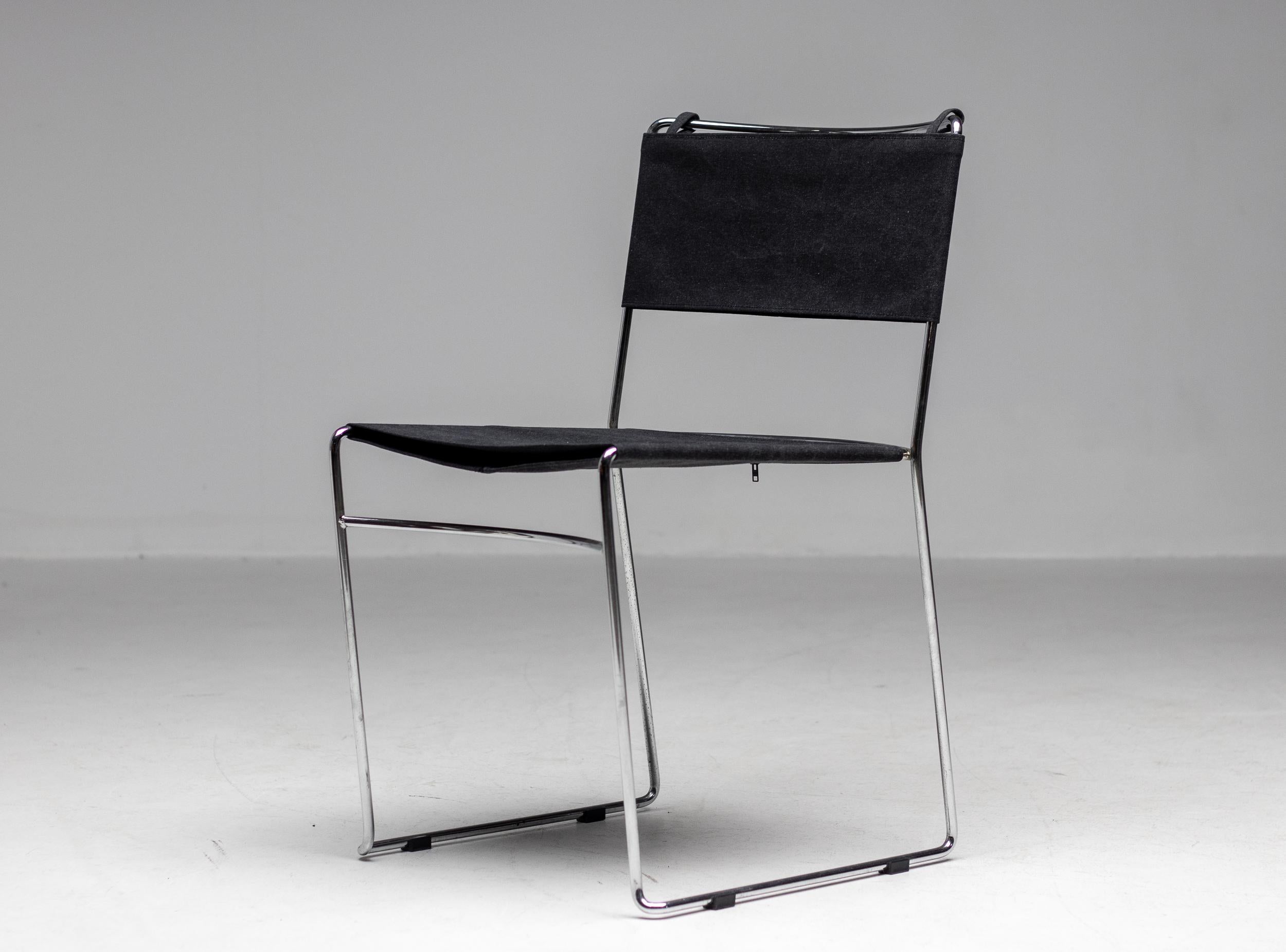 Elegant set of 4 dining chairs designed by Enzo Mari for Driade.
Chromed steel rod frame with charcoal cotton upholstery in excellent vintage condition.
Priced as a set.

Enzo Mari (1932-2020) was an Italian designer, artist, and theorist who
