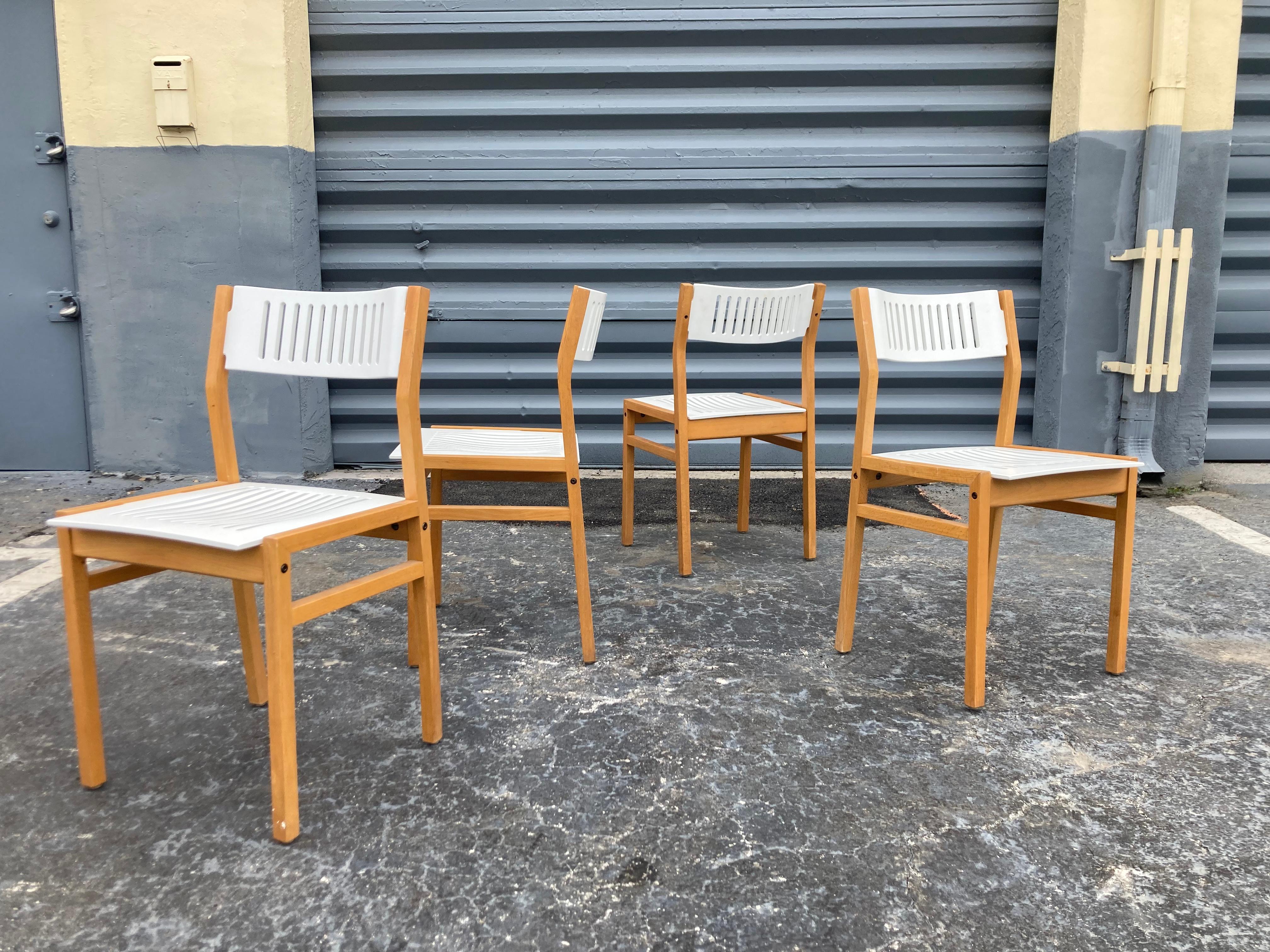 Set of Four Designer Dining Chairs. Bentwood seats and backs. Interesting design, matching dining table available.  Ready for a new home.