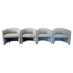 Set of Four Designer Mid-Century Upholstered Barrel Back Chairs on Castors
