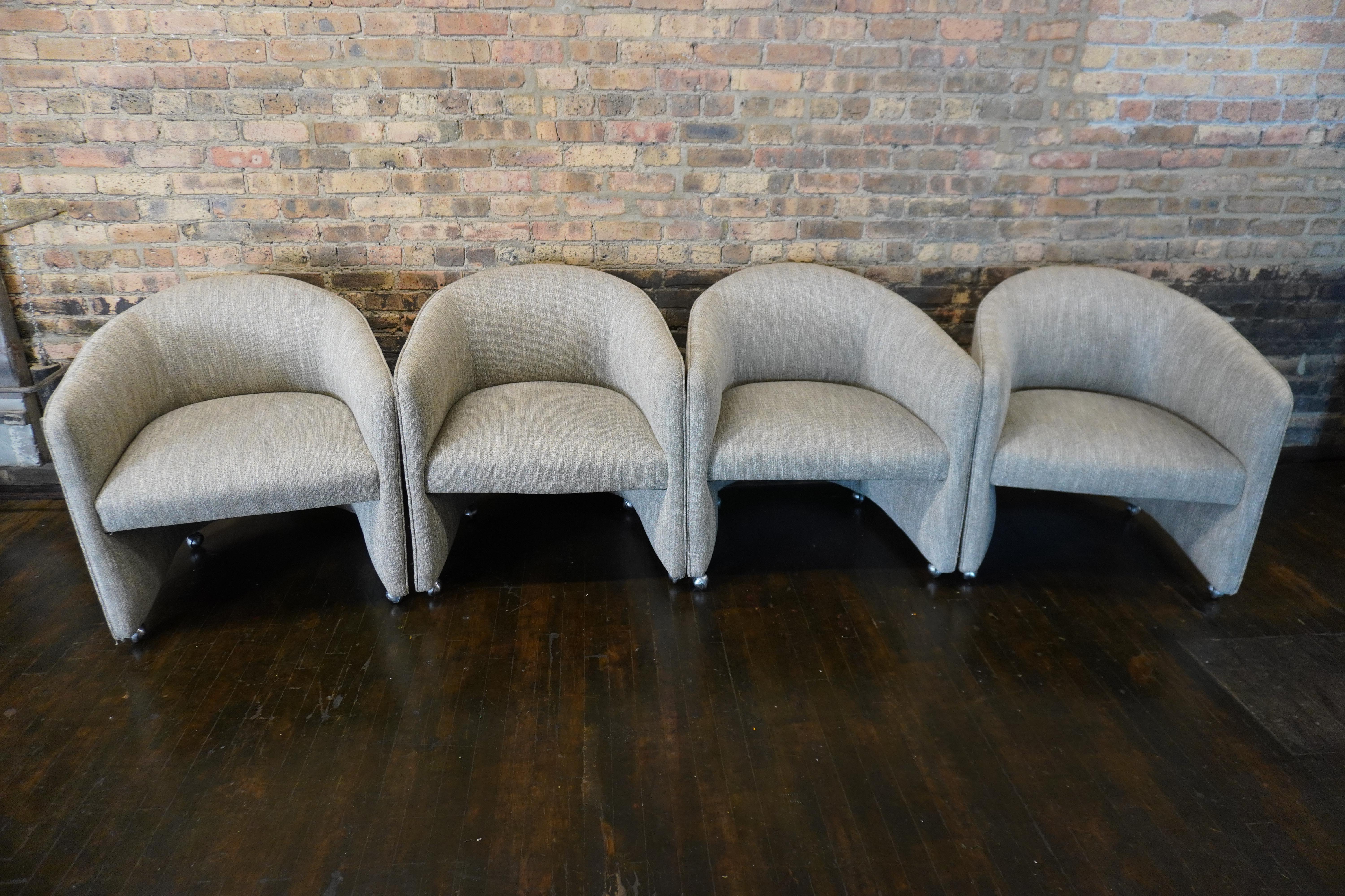 Set of 4 mid-century upholstered barrel back chairs on casters.  This set was purchased by an interior designer at the Merchandise Mart in Chicago in the early 80's.  They were designer chairs sold to the trade only.  

They were reupholstered once,