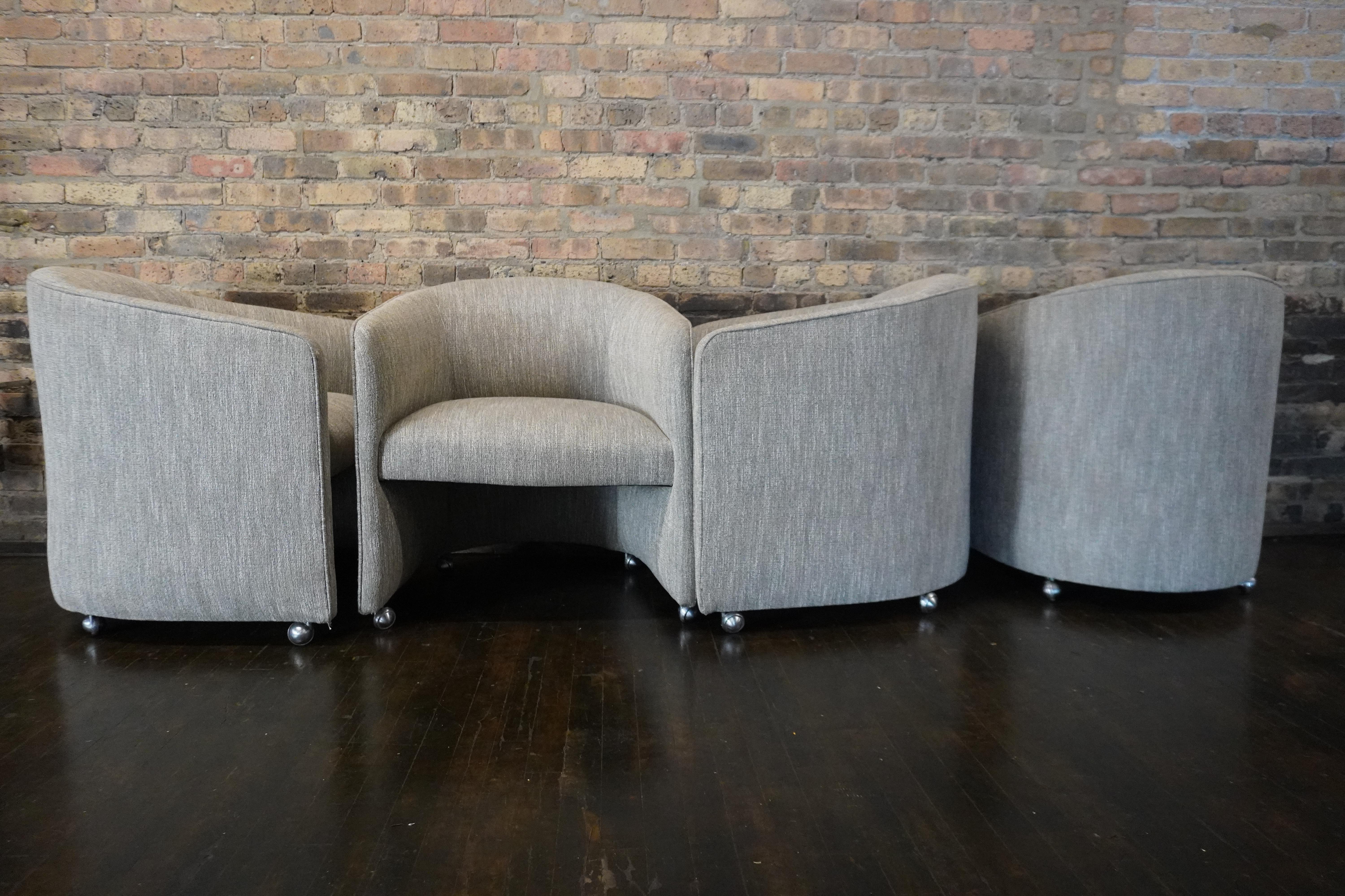 Mid-Century Modern Set of Four Designer Mid-Century Upholstered Barrel Back DiningChairs on Castors For Sale