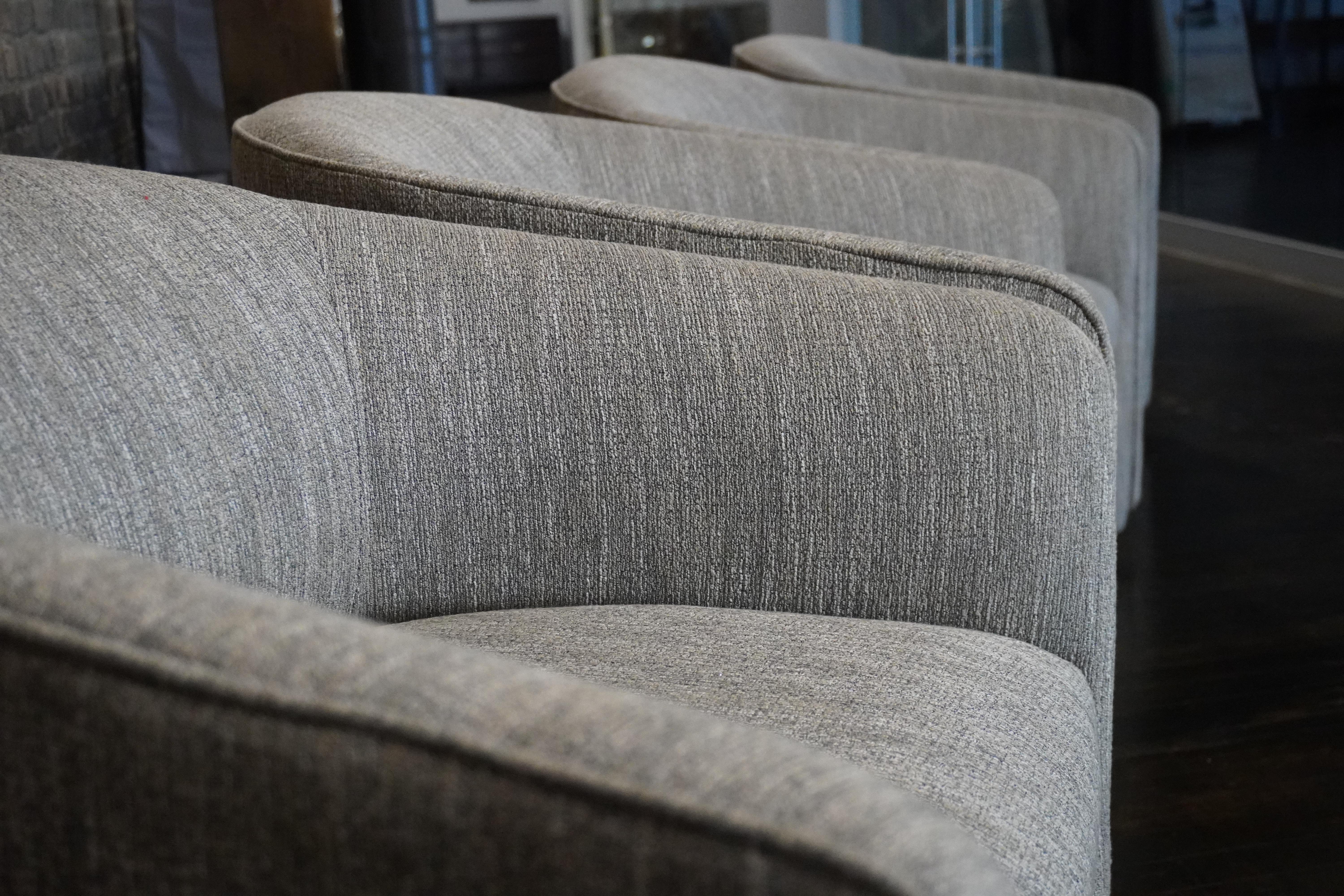 Set of Four Designer Mid-Century Upholstered Barrel Back DiningChairs on Castors In Good Condition For Sale In Chicago, IL