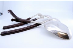 Set of four dessert spoons in hammered silver with wooden handles