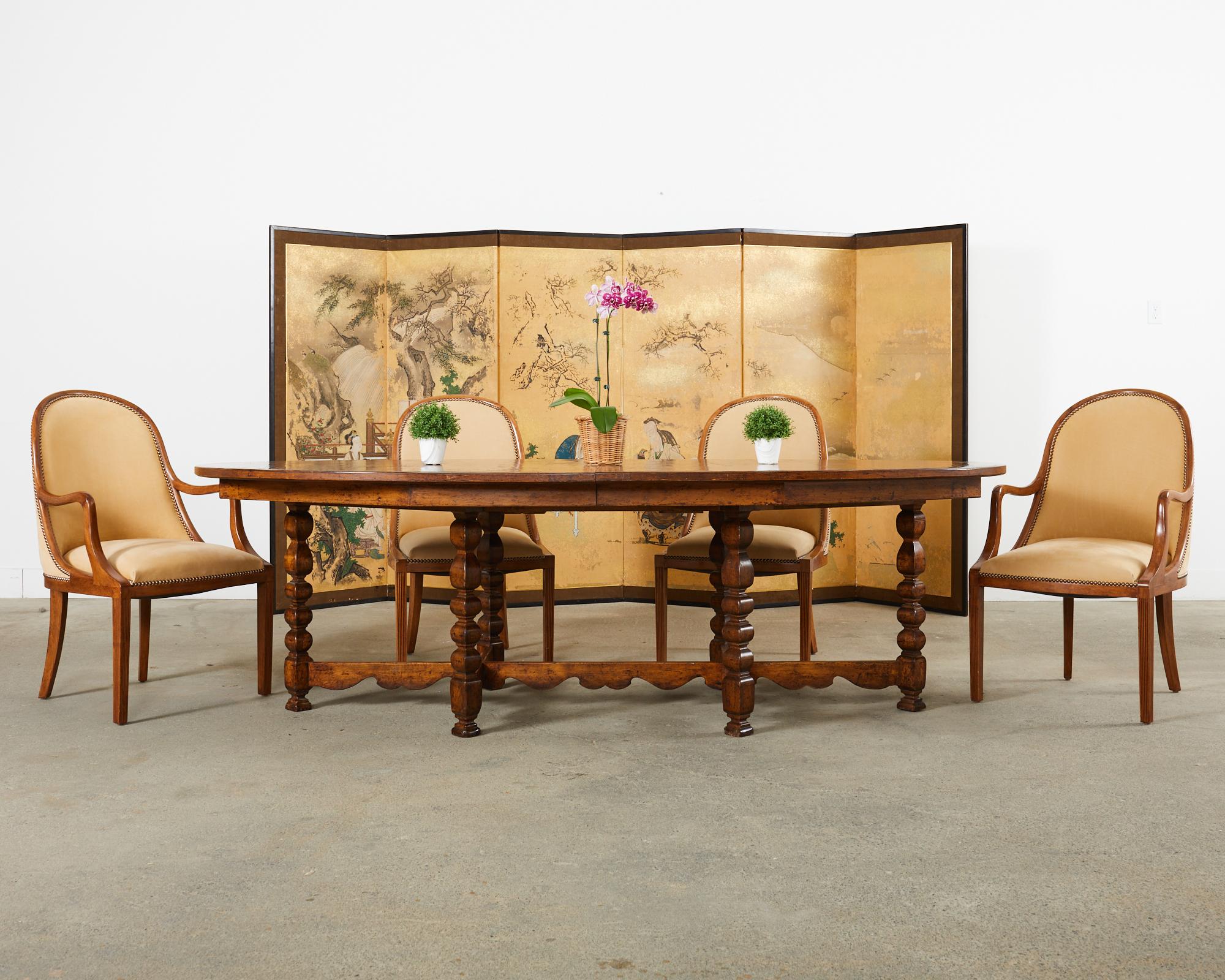 Amazing set of four leather Plante gondola dining chairs by Dessin Fournir. The set consists of two side chairs and two host armchairs with 26.5 inch high arms. The bespoke Plante chairs (model 1020-S) are hand-crafted from walnut and custom ordered