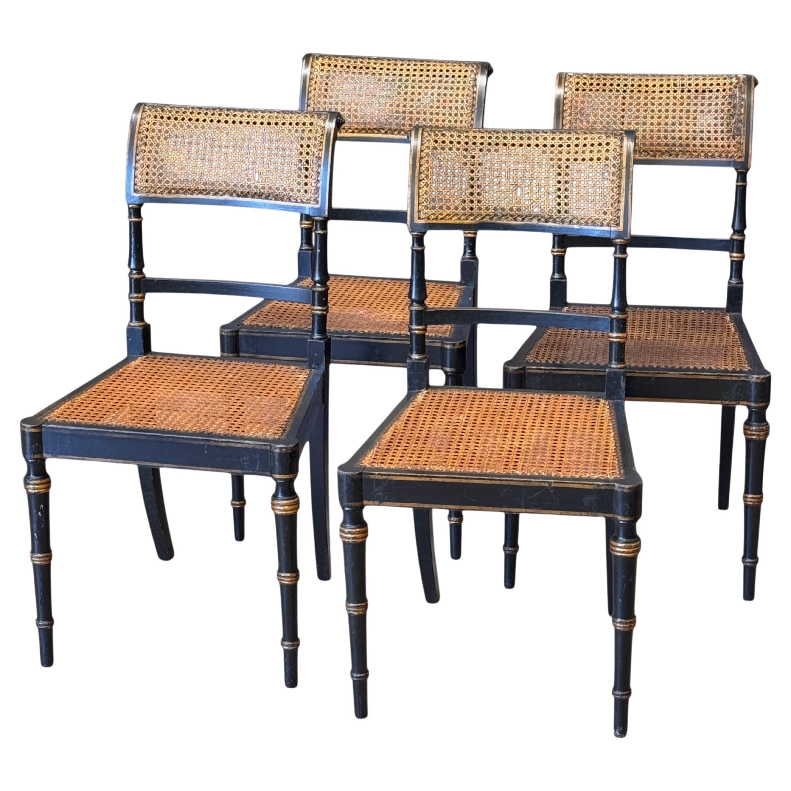 Set of Four Diminutive English Regency Ebonized and Caned Side Chairs