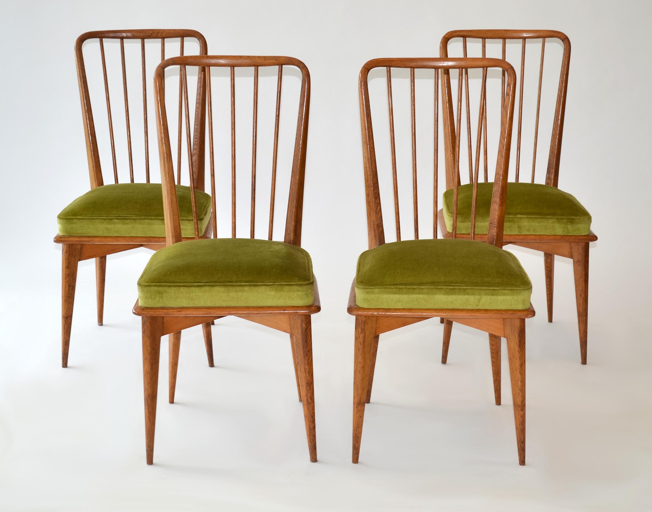 Set of Four Dining Chairs by Charles Ramos for Castellanetta Mid Century Modern 

Stained solid teak in original vintage condition with upholstered springed seats by French designer Charles Ramos, published by Castelanetta, Italy

Repairs and gluing