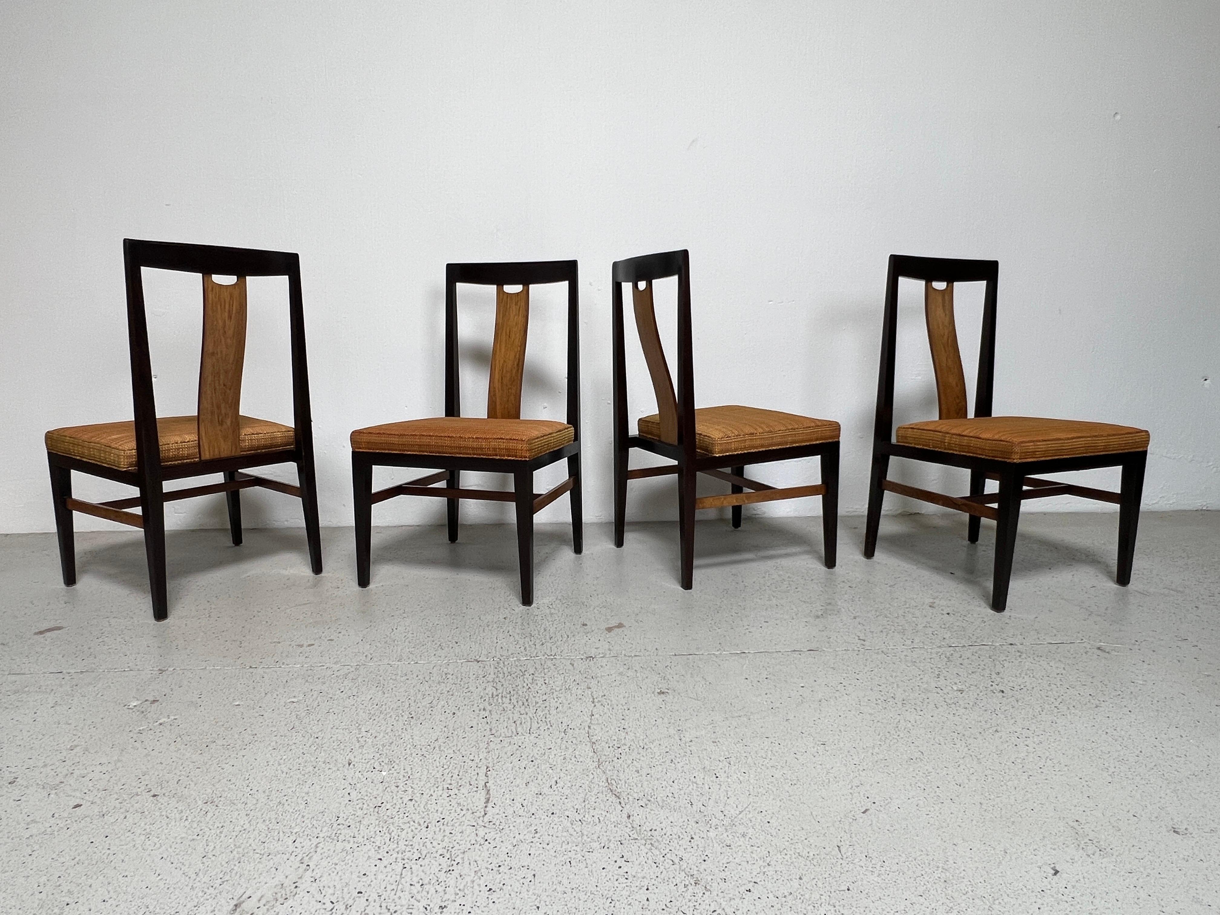 A rare set of four ash and rosewood dining / game chairs designed by Edward Wormley for Dunbar. Matching pair of archairs available separately.