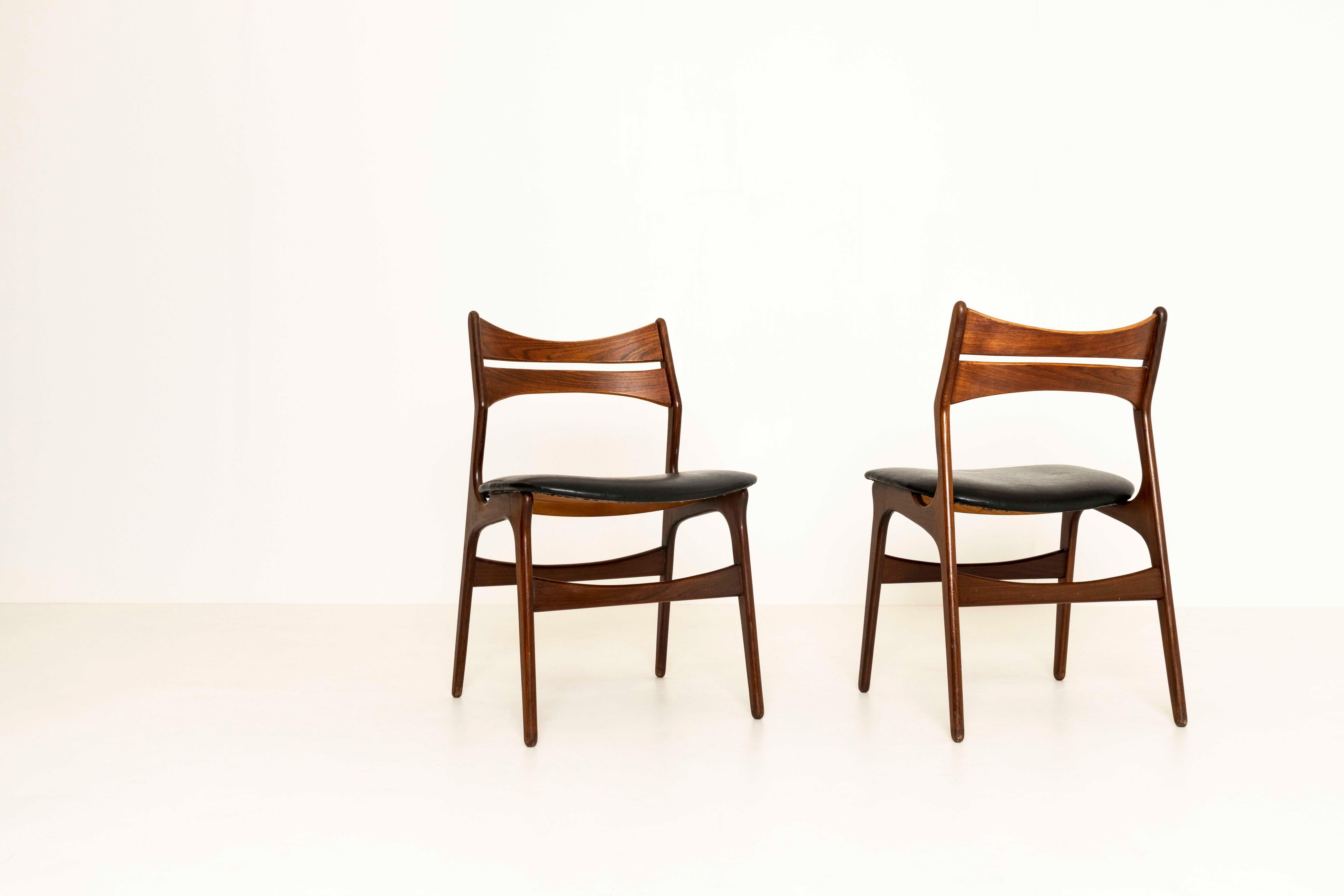 Beautiful set of four dining chairs by Erik Buch. This model 310 chair is produced for Christian Christensen in Denmark, ca 1960s. The chairs have a very interesting design, especially the backrest. The seating area is made of leather and the chairs
