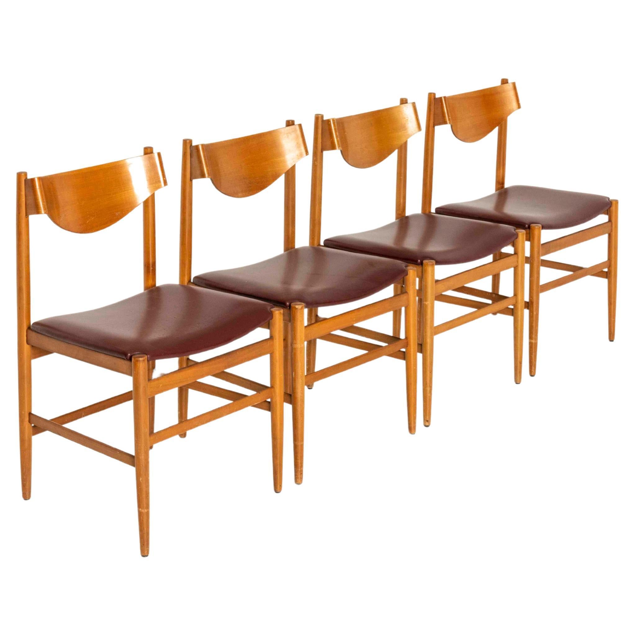 Set of Four Dining Chairs by Gianfranco Frattini for Cassina from the 1960s. The chairs are made of teak with a molded plywood back and red (faux) leather. They have great aesthetics and are in good condition with normal wear and tear due to their