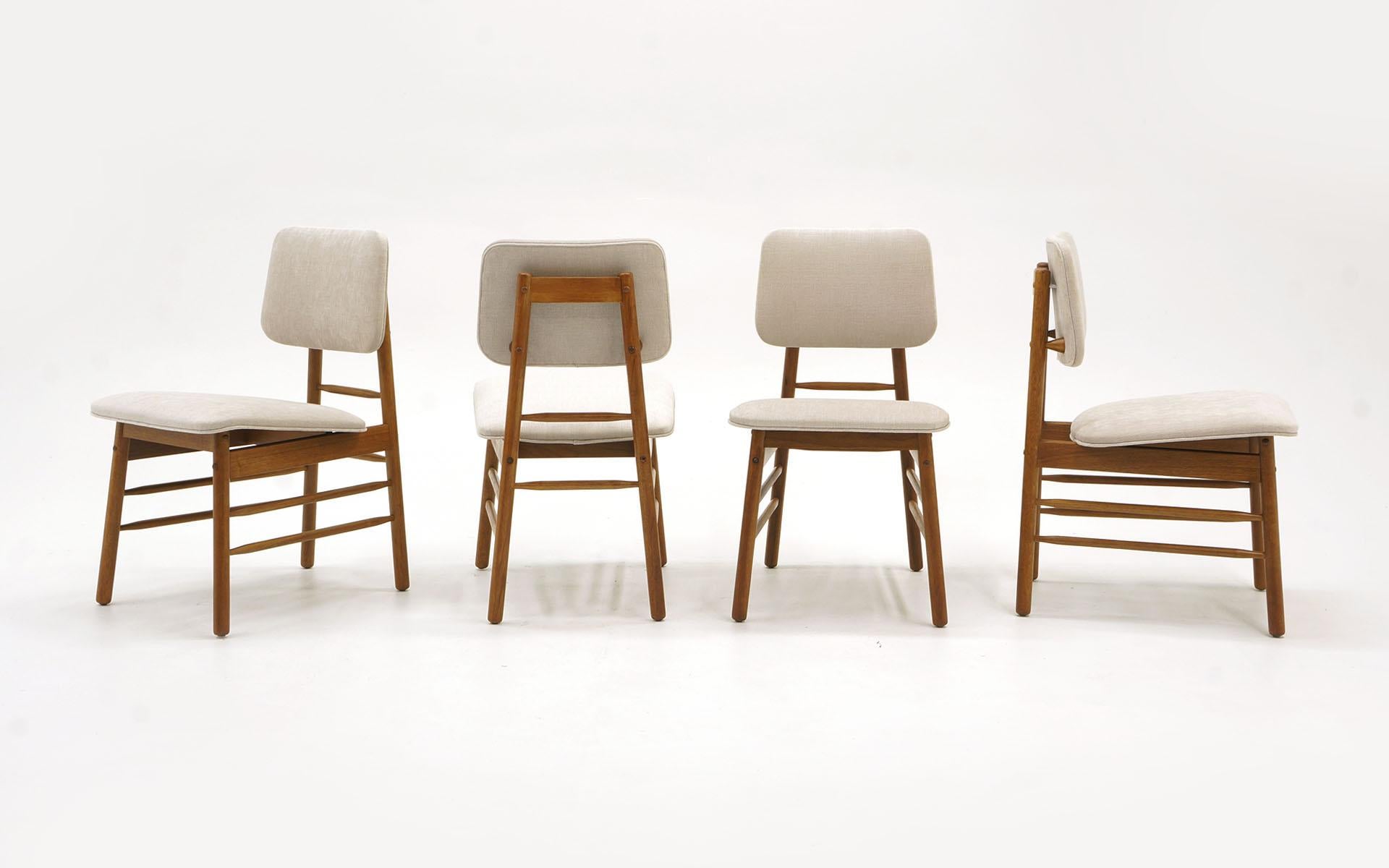Set of four dining chairs designed by Greta Grossman. Expertly refinished and reupholstered in a soft, beautiful Knoll fabric.