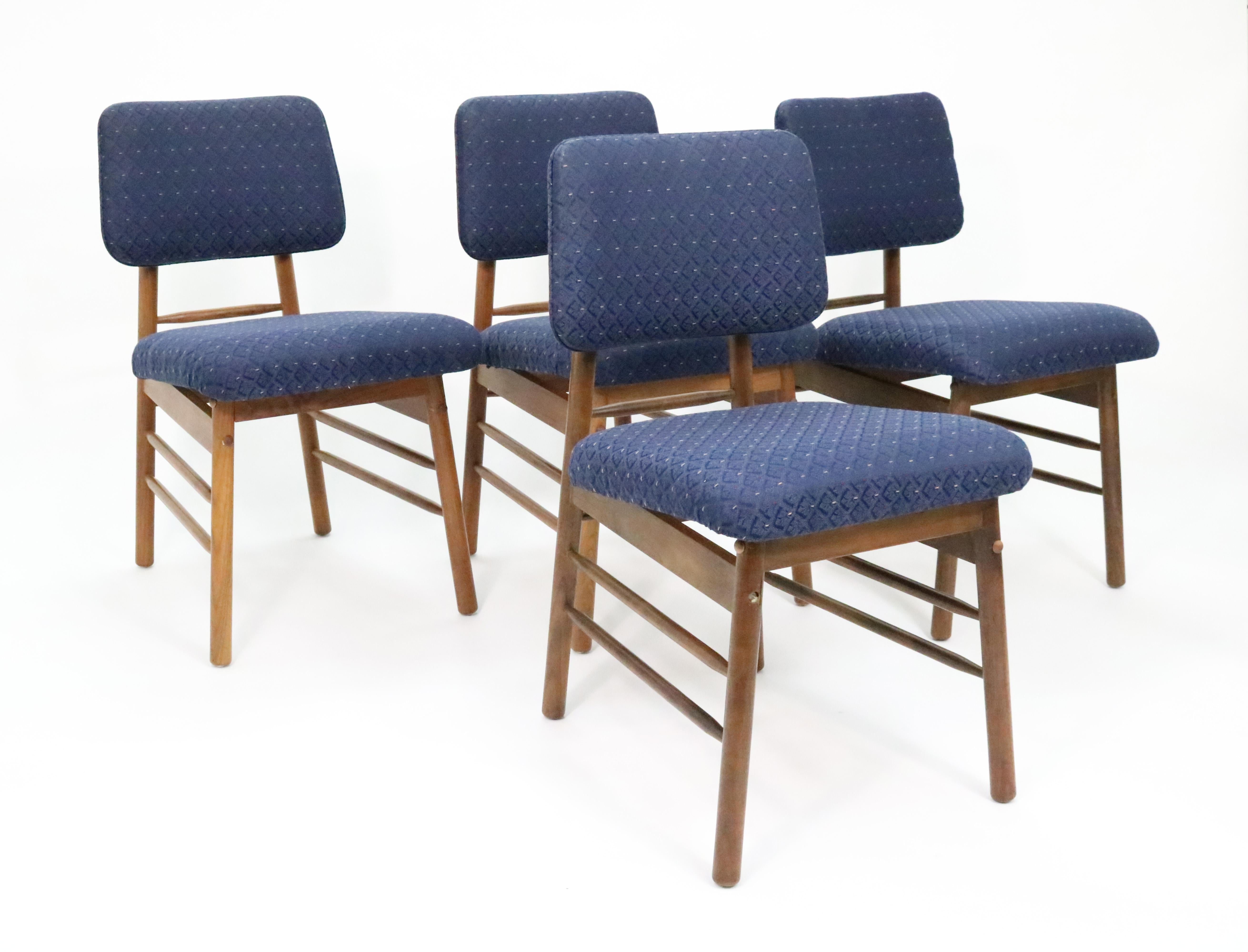 Set of four Model 6260 dining chairs by Greta Magnusson Grossman for Glenn of California.

These chairs earned the Good Design award from the Museum of Modern Art in New York.