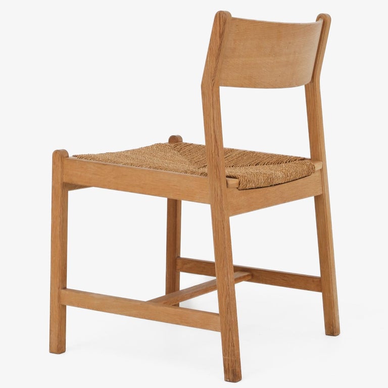 Set of four dining chairs in oak and paper cord. Hans J. Wegner / C. M. Madsen.