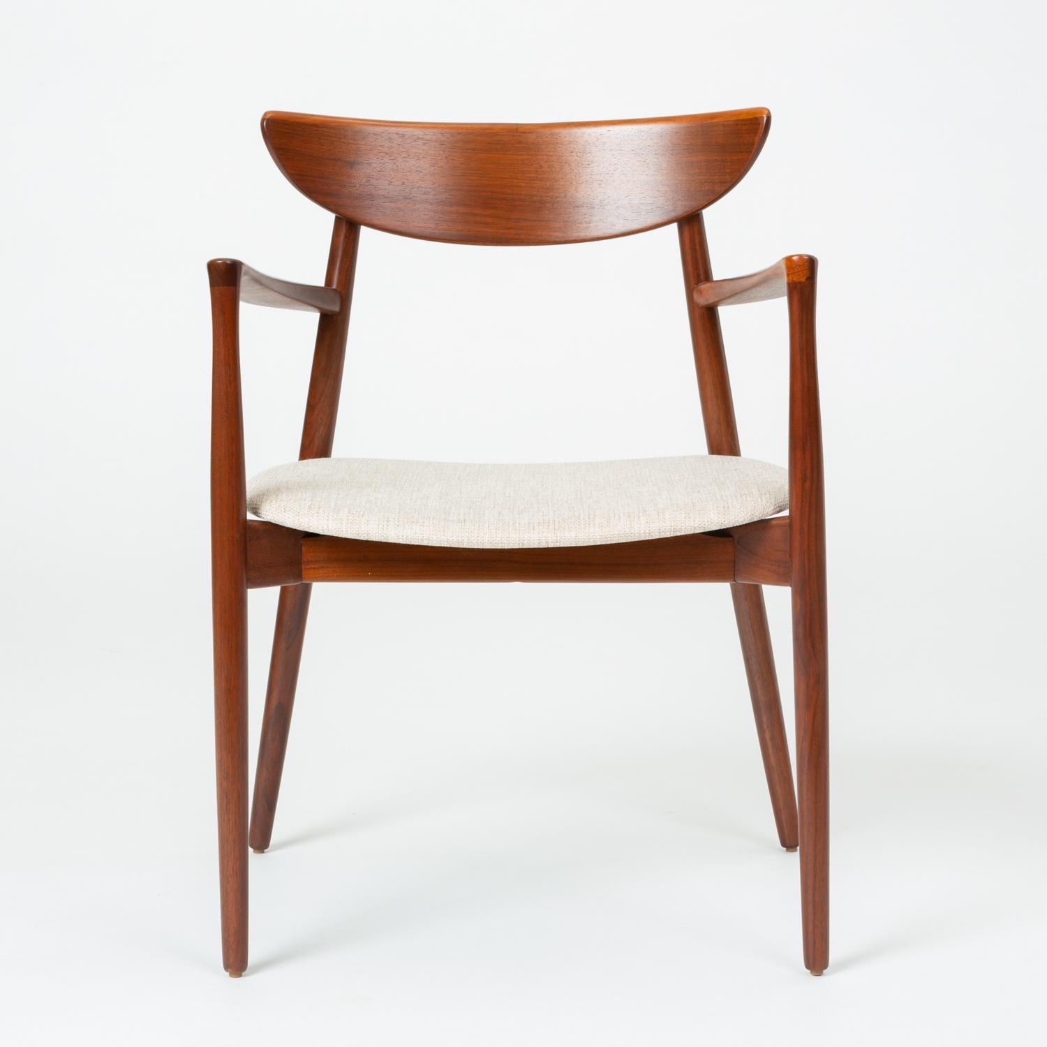 Designed circa 1960 by Harry Østergaard, this set of dining chairs includes two arm chairs and two side chairs. Manufactured in Denmark by Randers Møbelfabrik, the chairs were imported, like many other Randers designs, by the Long Beach-based
