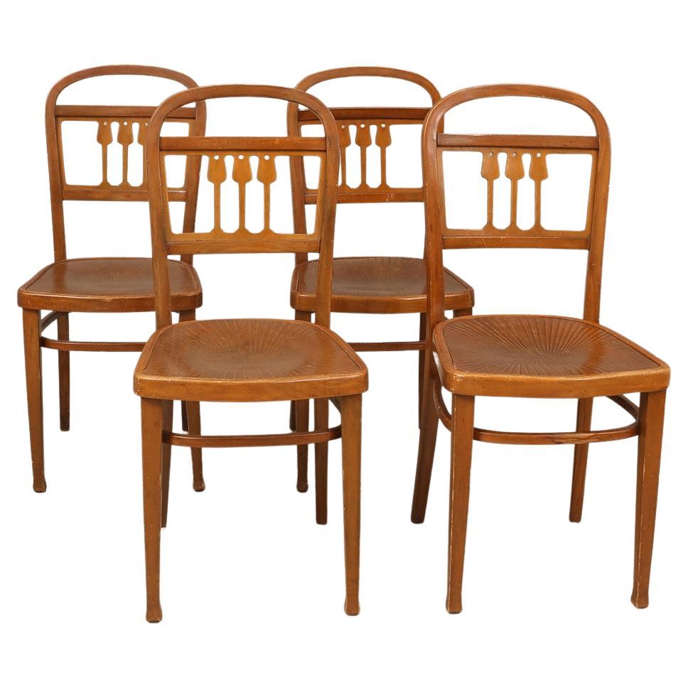 Ensemble de quatre chaises de salle à manger par J. Kohn