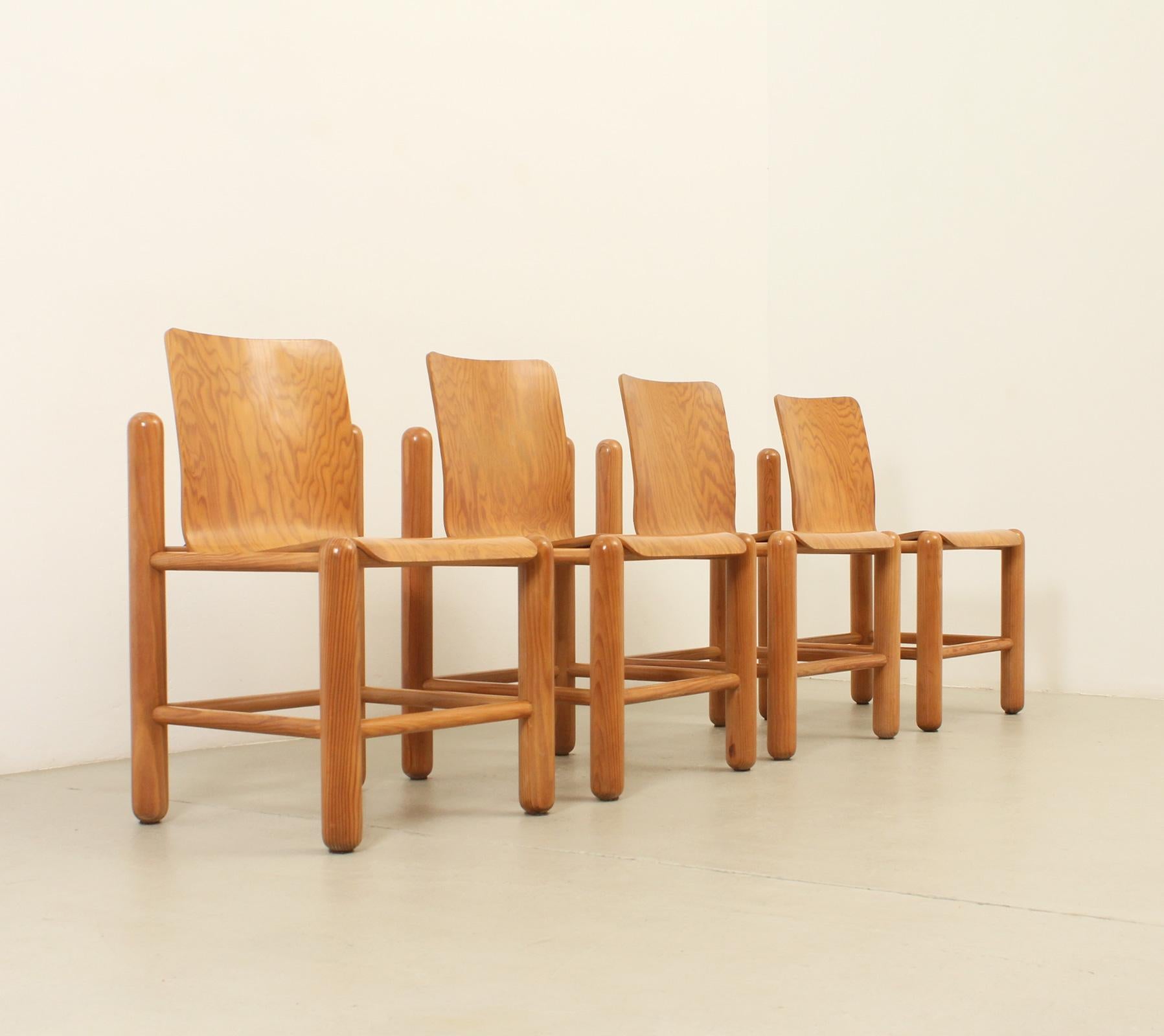 Set of four dining chairs designed by Danish architects Knud Friis and Elmar Moltke Nielsen for Getama, Denmark, 1970's. Pine wood with with plywood seat and metal. 