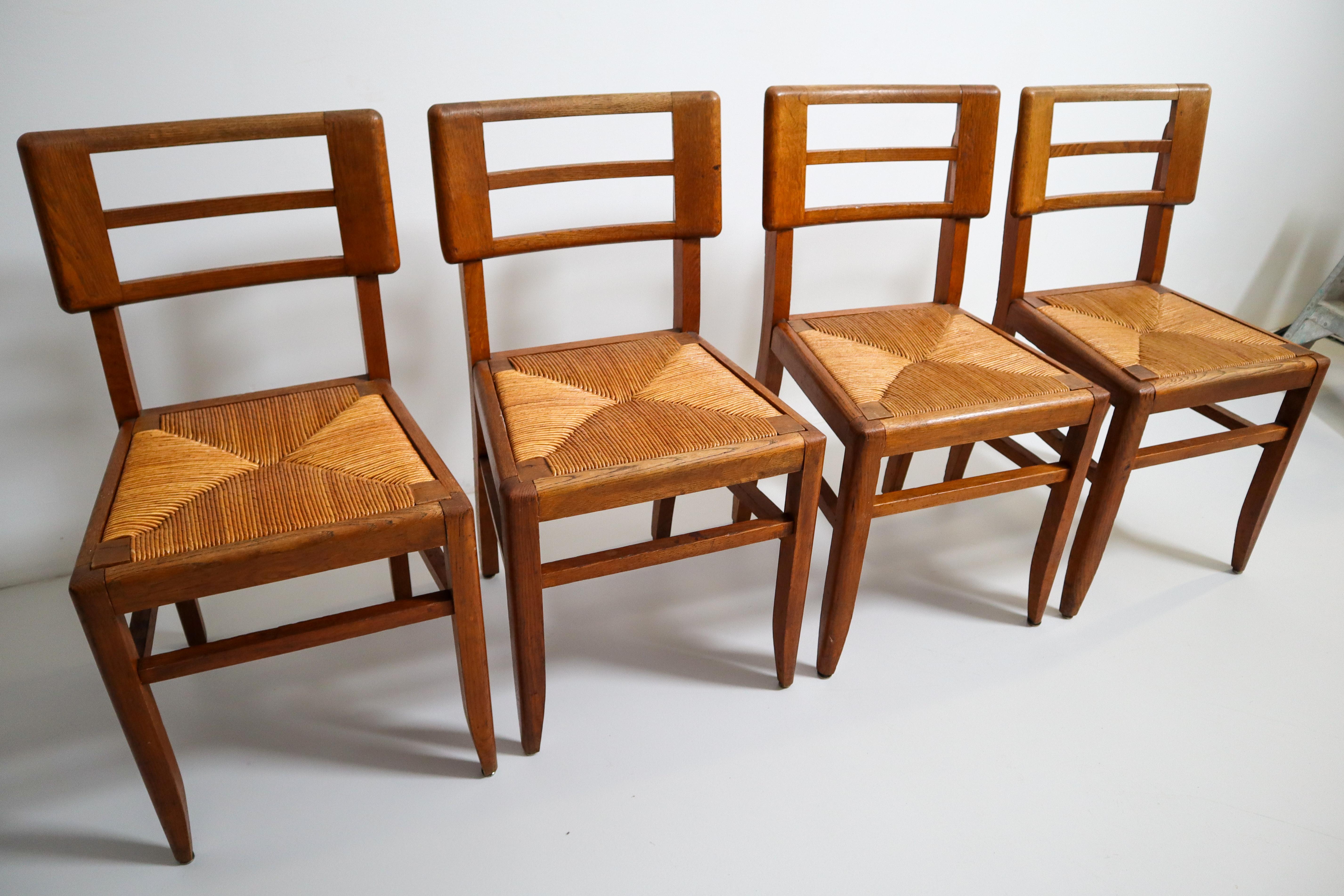 Set of Four Dining Chairs by Pierre Cruege in Oak and Cane, France, 1940s In Good Condition For Sale In Almelo, NL