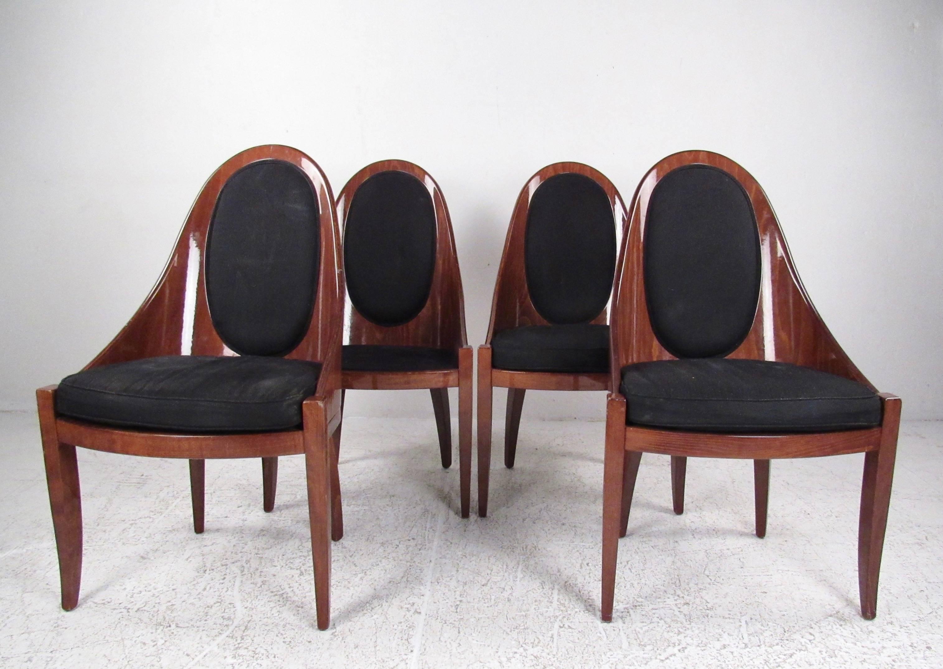 This stylish set of Italian modern dining chairs by Pietro Costantini features lacquered wood finish, sculpted seat backs, and upholsters seats. Elegant and impressive set of four chairs perfect for dining room or kitchen seating. Please confirm