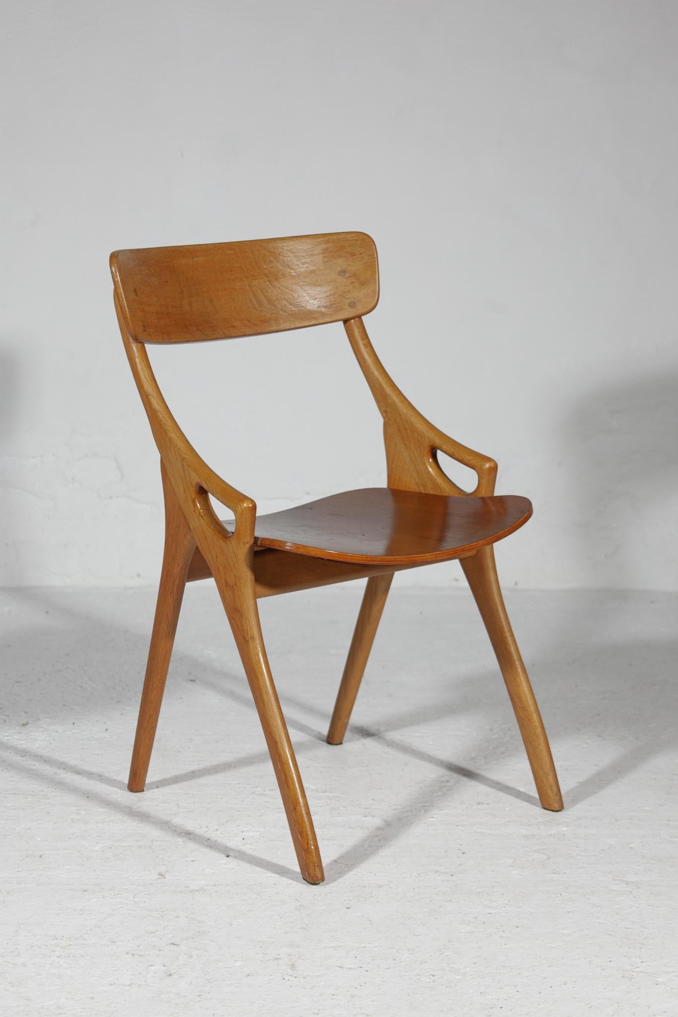 Vintage rare set of four dining-room chairs, designed by Arne Hovmand Olsen for Mogens Kold Mobelfabrik, Denmark.The chairs are organic in their shape the rounded, almost branch like legs and the elegant open detail in the armrests. There are little