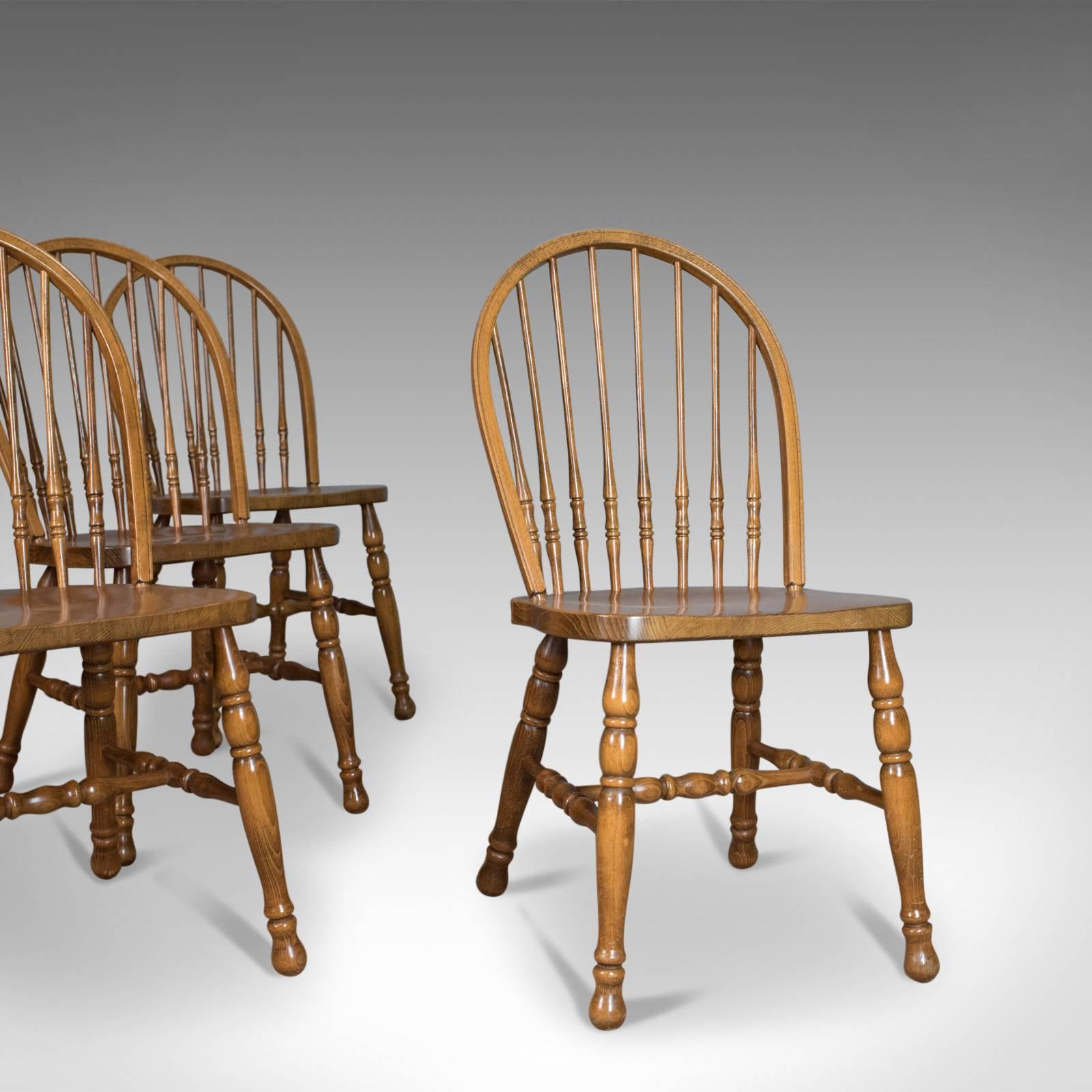 This is a set of four dining chairs, French Provincial hoop stick back chairs in beech from the late 20th century.

Attractive set of French farmhouse country kitchen chairs
Of quality construction displaying well with a wax polished