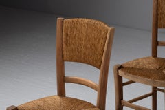 Satz von vier Esszimmerstühlen aus Eiche und Binsen, Frankreich, 1950er Jahre